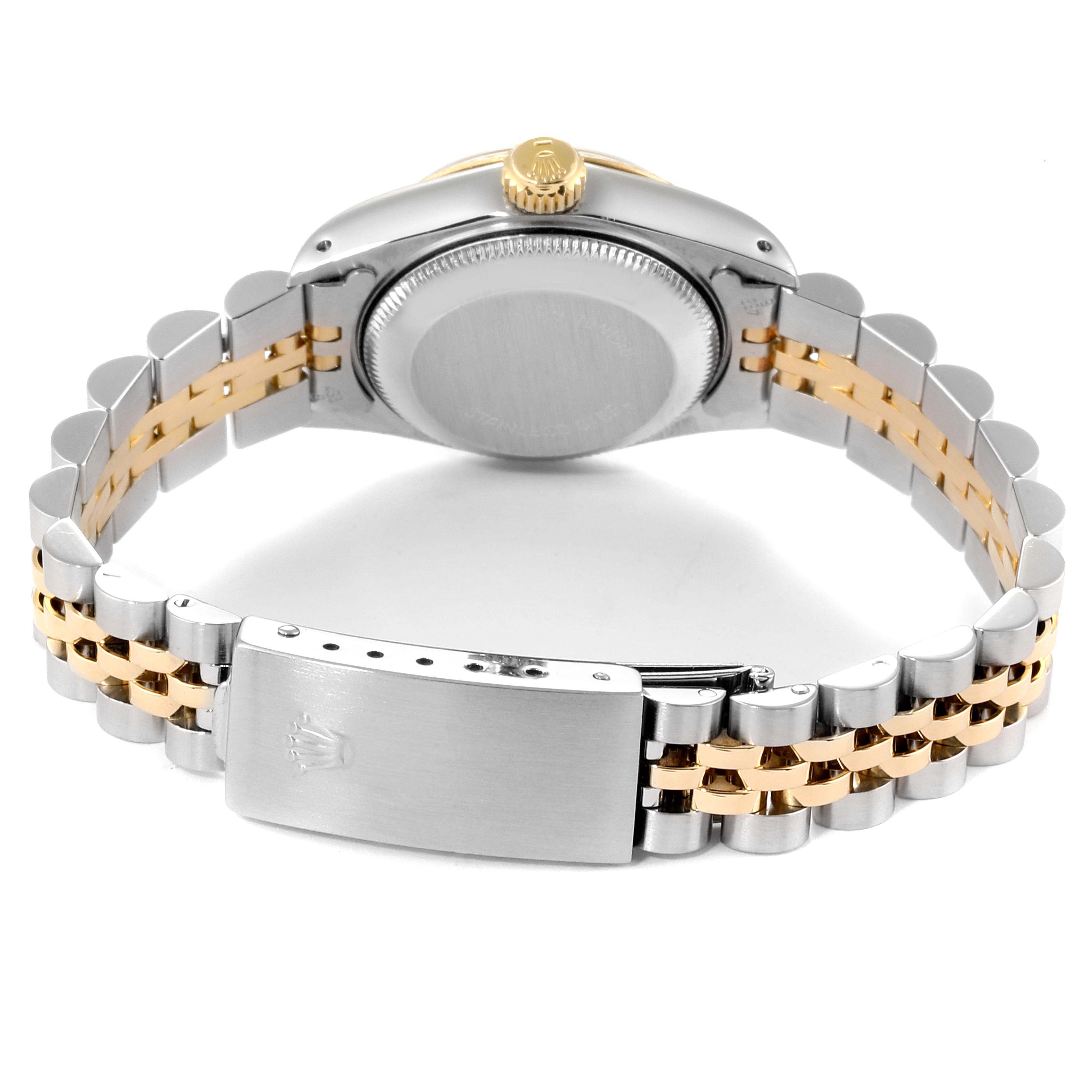 The image shows the back angle of a Rolex Datejust 69173 Women
s Steel and Gold (two tone) Champagne Dial 69173 Women
s Steel and Gold (two tone) Champagne Dial watch, highlighting its two-tone bracelet and clasp.