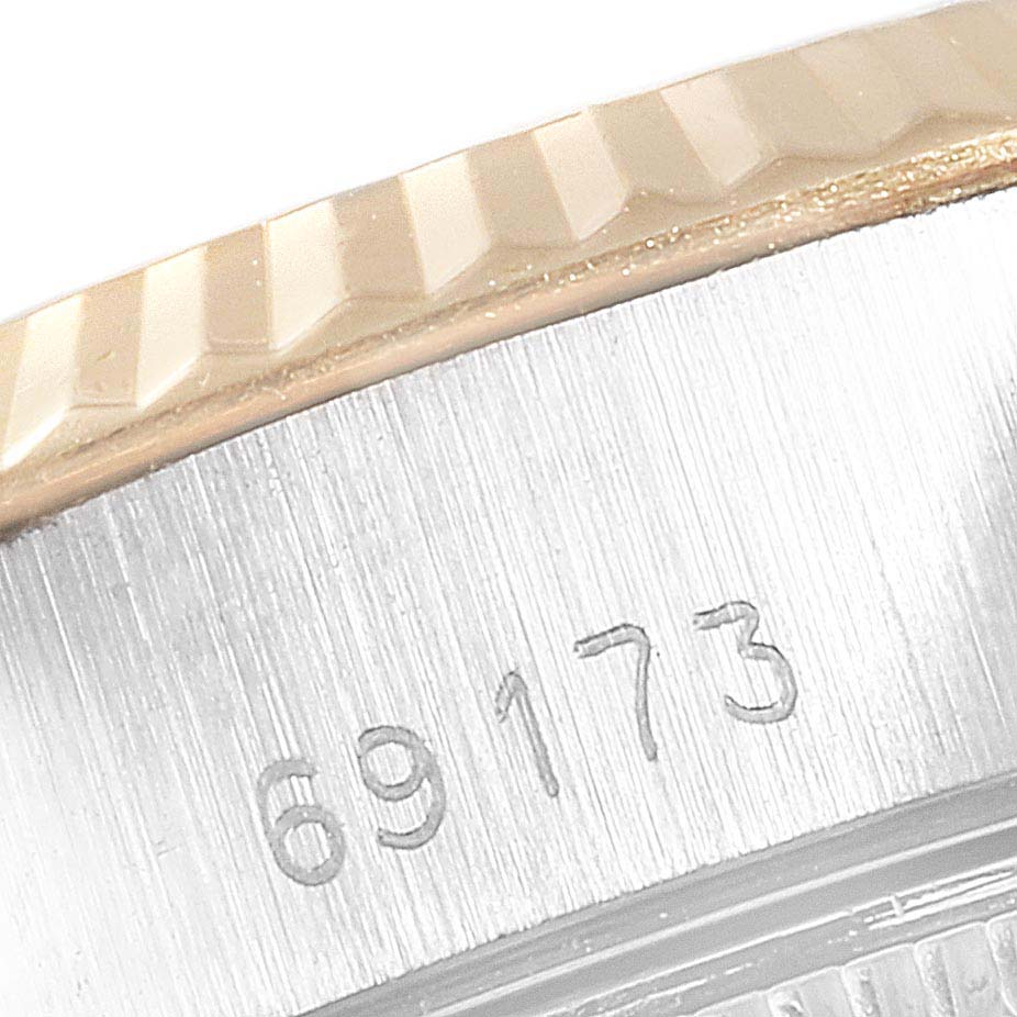 The image shows a close-up of the engraved model number (69173) and part of the fluted bezel of a Rolex Datejust 69173 Women
s Steel and Gold (two tone) Champagne Dial 69173 Women
s Steel and Gold (two tone) Champagne Dial watch.