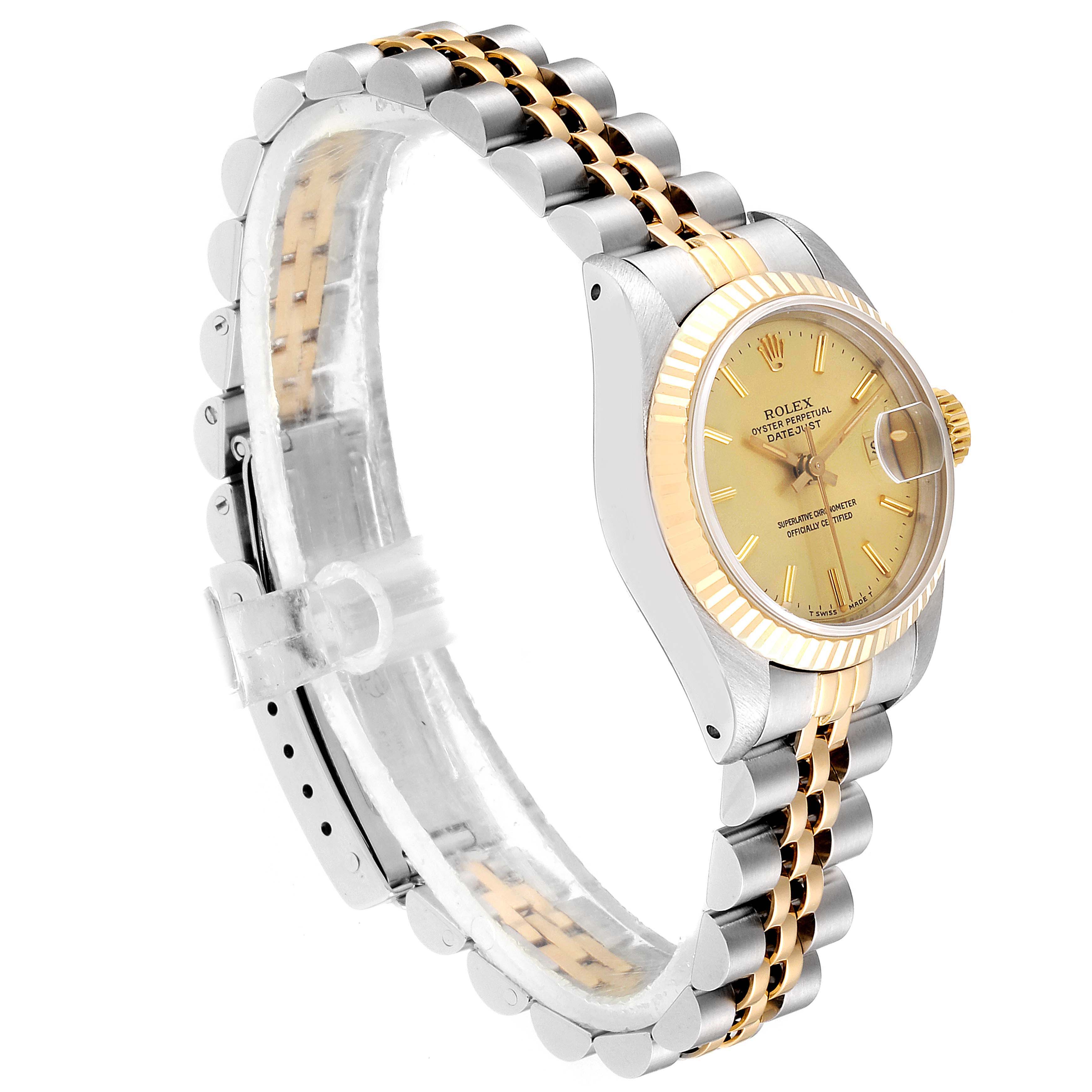 The image shows a side angle of a Rolex Datejust 69173 Women
s Steel and Gold (two tone) Champagne Dial 69173 Women
s Steel and Gold (two tone) Champagne Dial watch, highlighting the face, bezel, and two-tone bracelet.