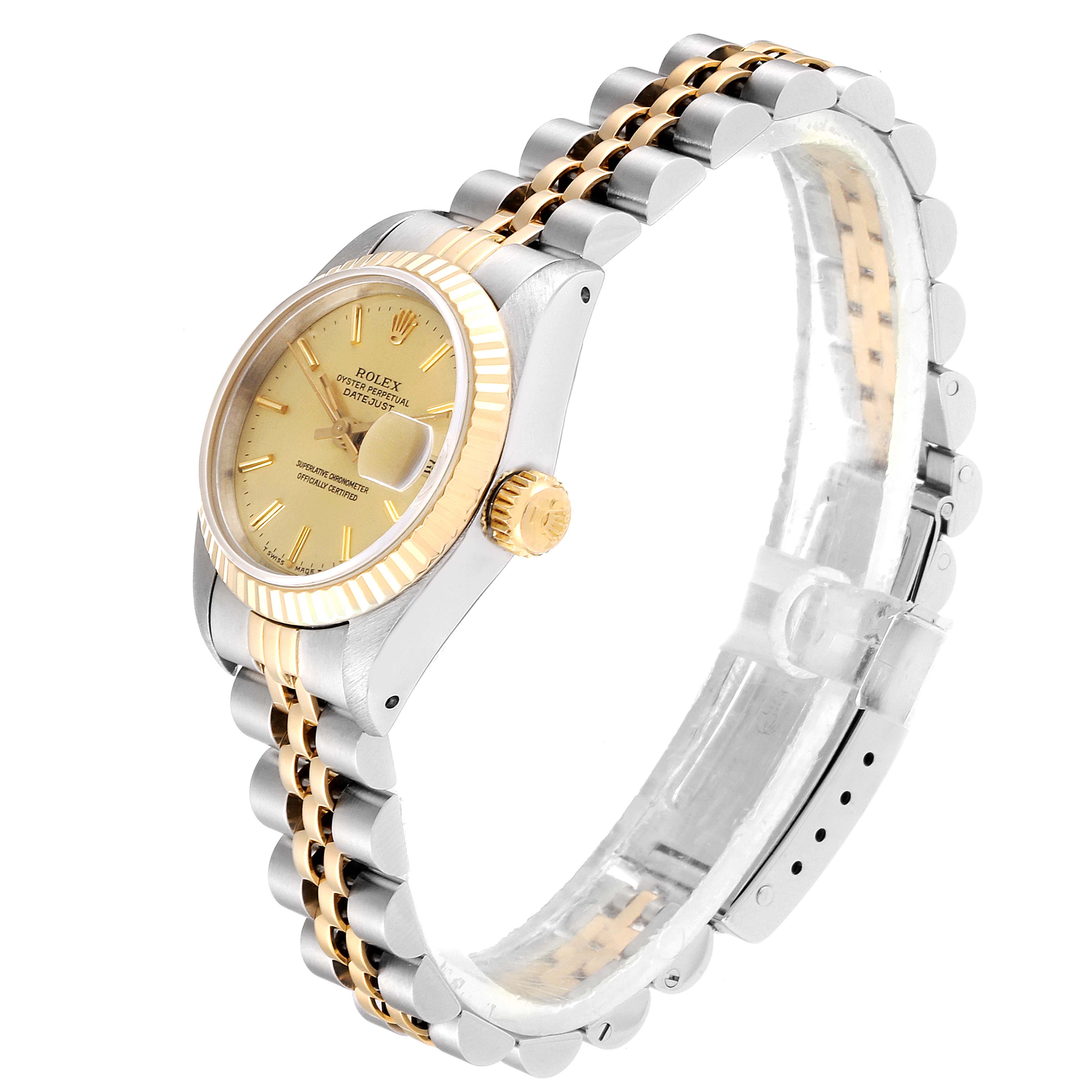 The Rolex Datejust 69173 Women
s Steel and Gold (two tone) Champagne Dial 69173 Women
s Steel and Gold (two tone) Champagne Dial watch is shown at an angled side view, highlighting the dial, fluted bezel, crown, and two-tone bracelet.
