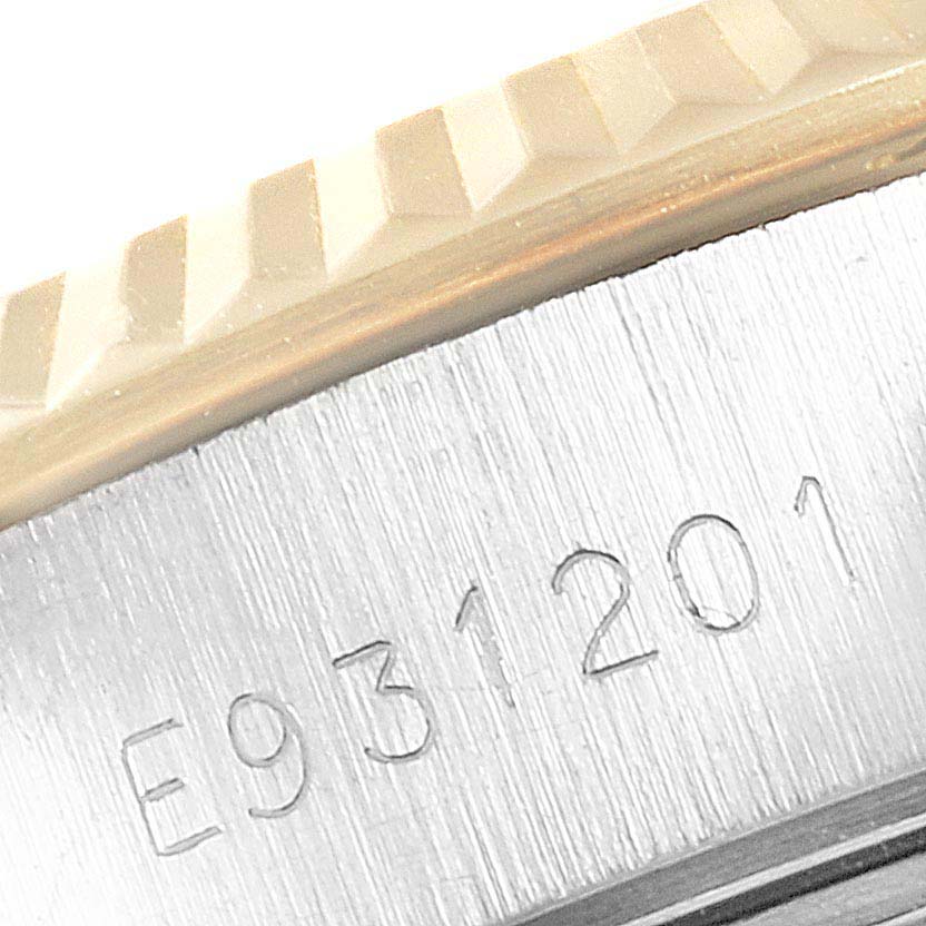 The image shows a close-up of the serial number engraved on the case of a Rolex Datejust 69173 Women
s Steel and Gold (two tone) Beige Dial 69173 Women
s Steel and Gold (two tone) Beige Dial watch with the bezel edge visible.