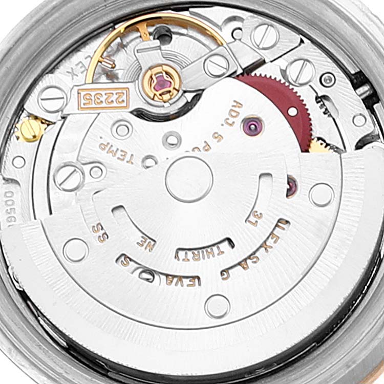 The image shows the movement and internal mechanism of a Rolex Datejust 79163 Women
s Steel and Gold (two tone) Grey Dial 79163 Women
s Steel and Gold (two tone) Grey Dial watch from a top-down angle.