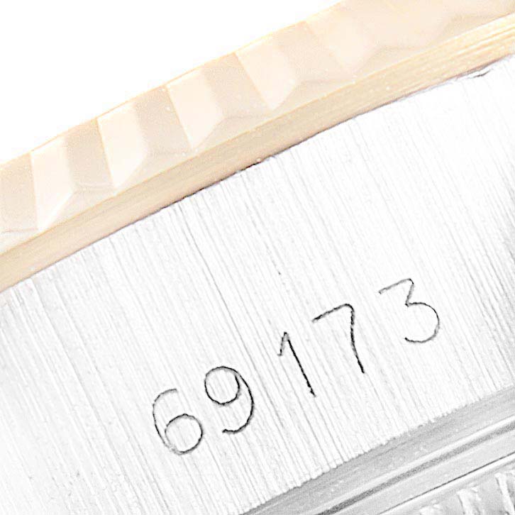This close-up image shows the model number "69173" etched on the side of the Rolex Datejust 69173 Women's Steel and Gold (two tone) White Dial 69173 Women's Steel and Gold (two tone) White Dial watch case.