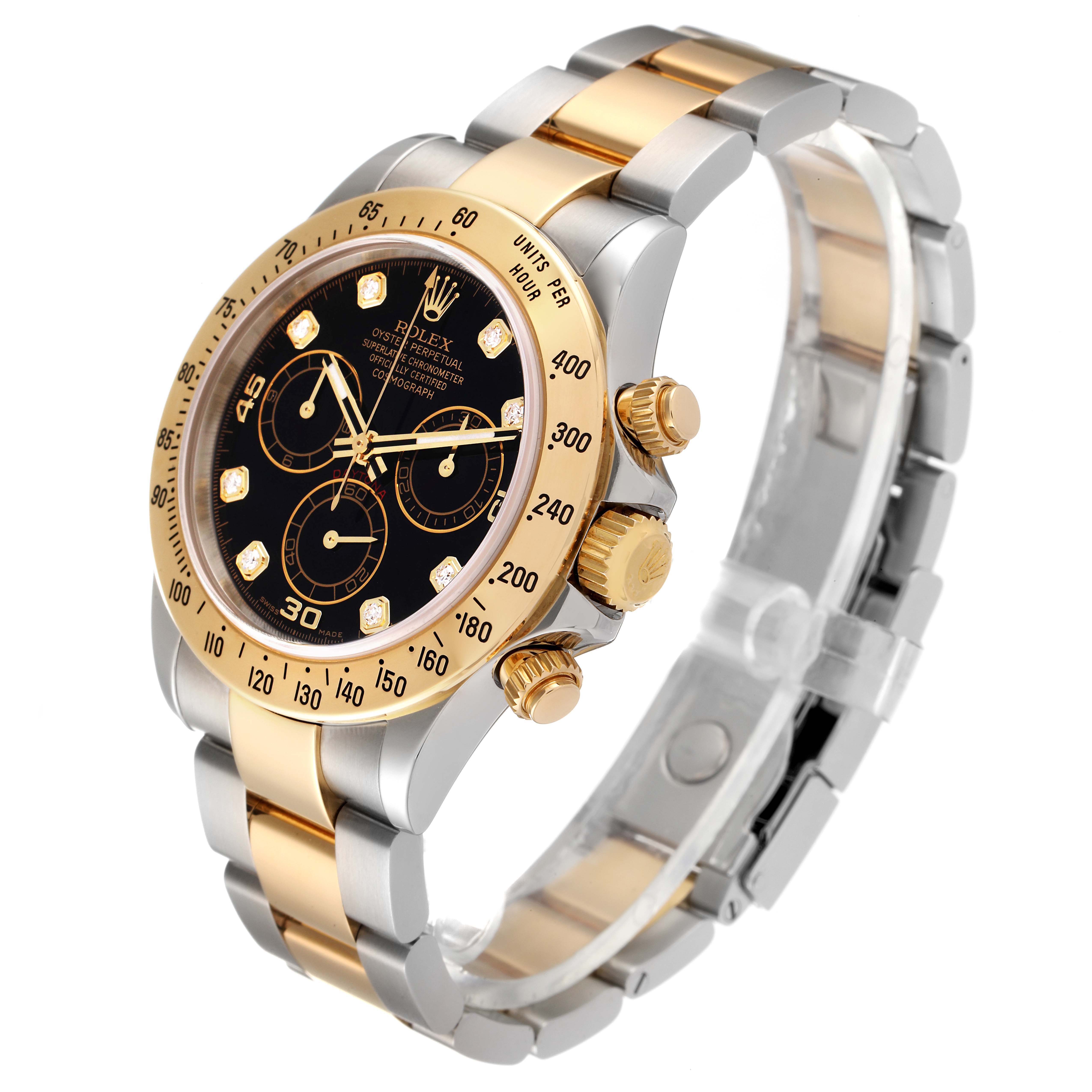 This image shows a side-angle view of a Rolex Daytona 116523 Men's Steel and Gold (two tone) Black Dial 116523 Men's Steel and Gold (two tone) Black Dial watch, highlighting its black dial, gold bezel, chronograph subdials, and two-tone bracelet.