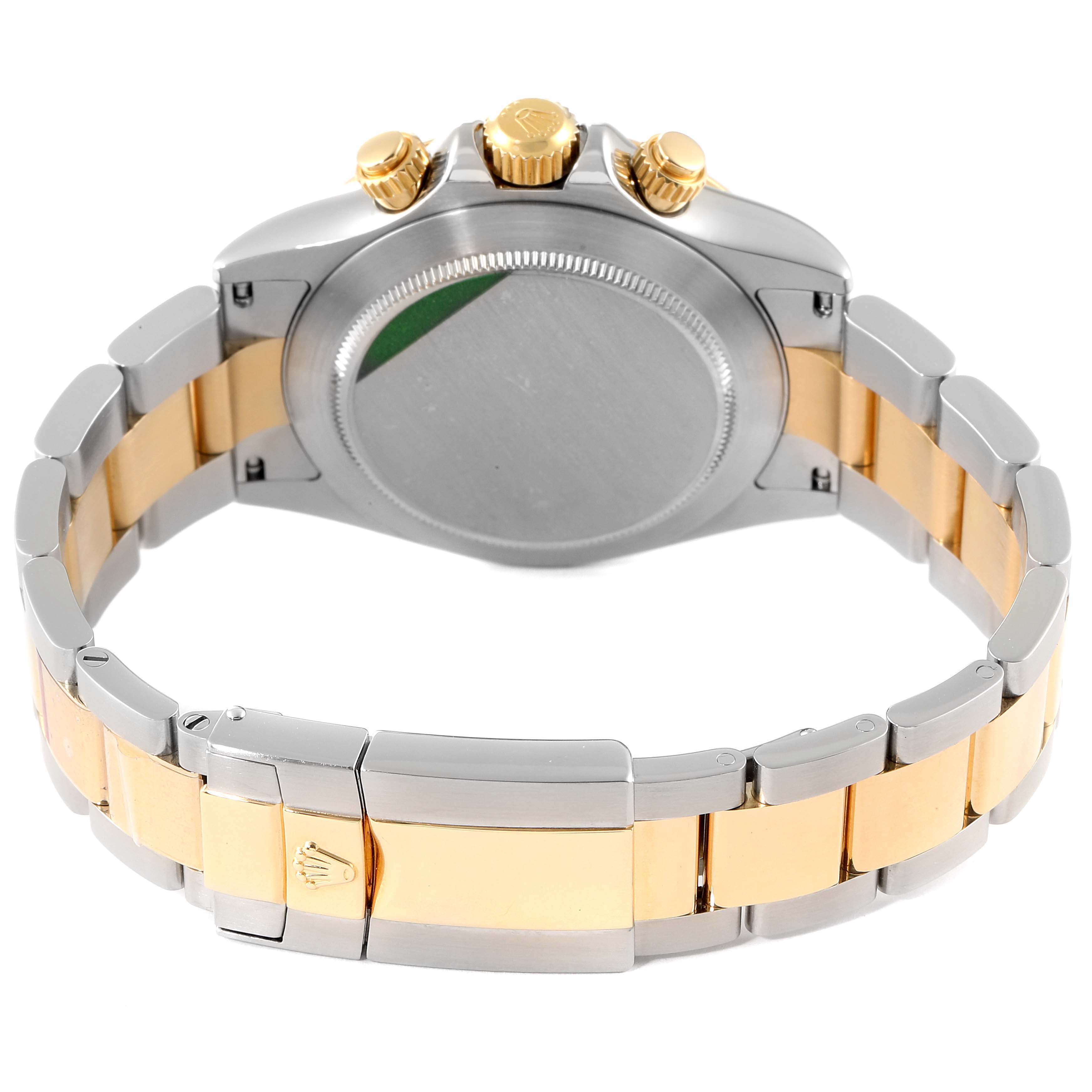 The image shows the back view of a Rolex Daytona 116523 Men's Steel and Gold (two tone) Black Dial 116523 Men's Steel and Gold (two tone) Black Dial watch, highlighting the clasp, bracelet, and crown.