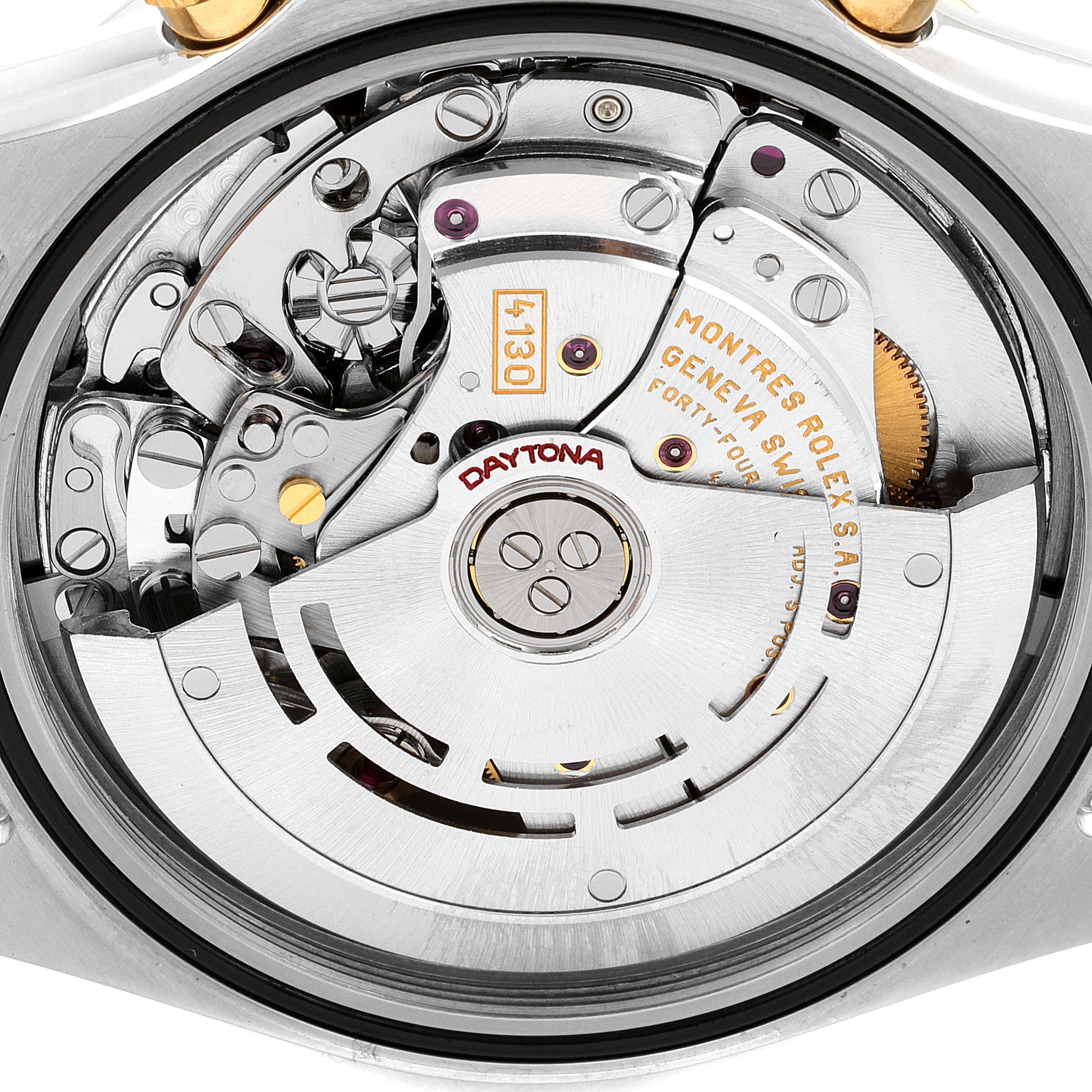 The image shows a close-up of the movement mechanism of a Rolex Daytona 116523 Men's Steel and Gold (two tone) Black Dial 116523 Men's Steel and Gold (two tone) Black Dial watch.