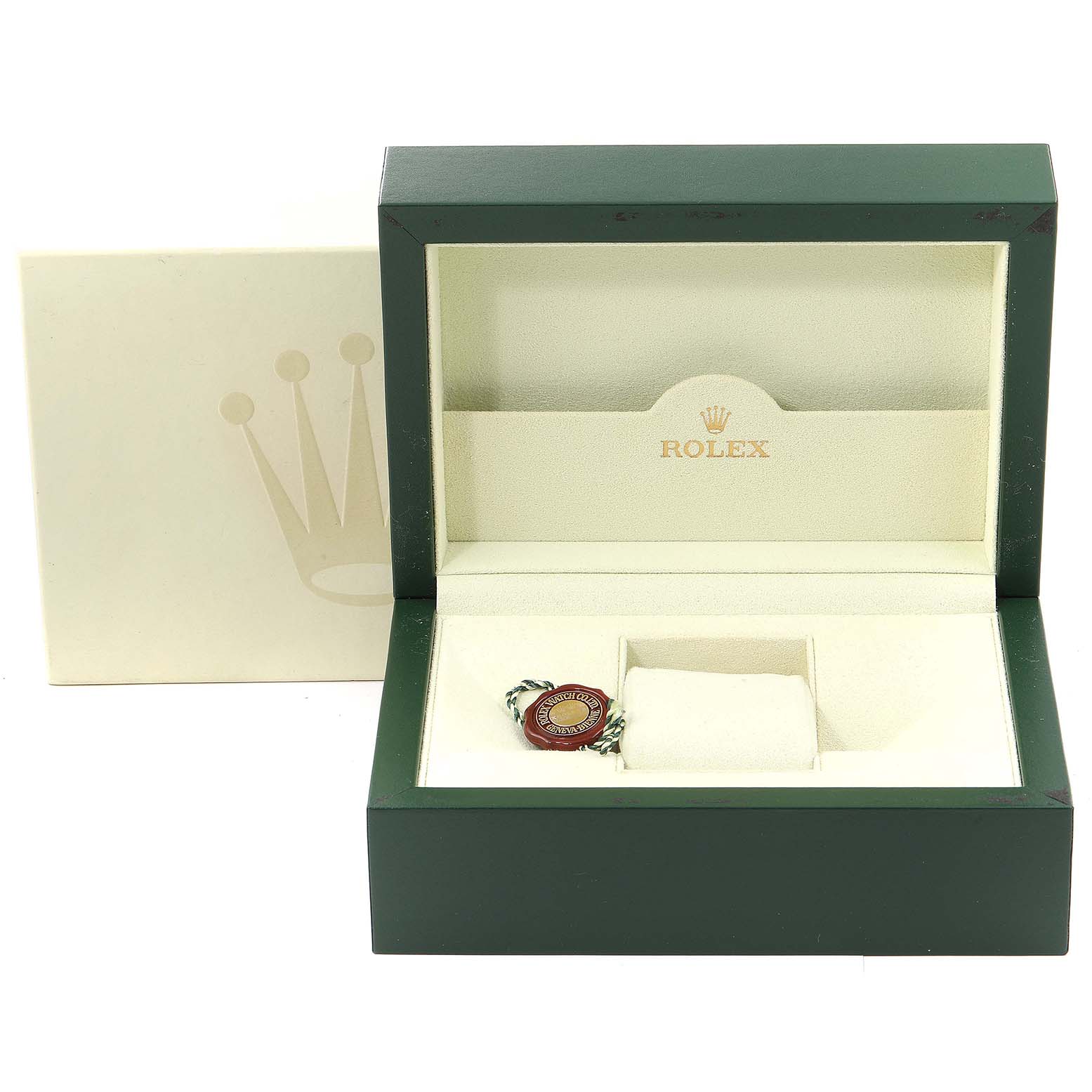 The image shows an open Rolex watch box for a Daytona model, with a tag and a cushion insert.