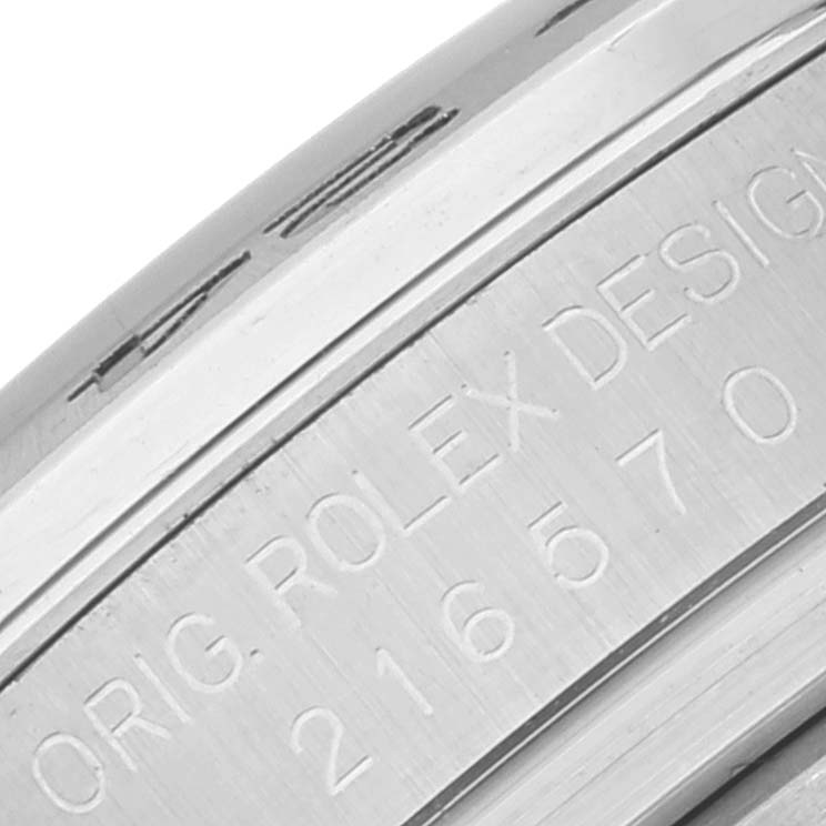 The image shows a close-up of the engraving on the side of a Rolex Explorer 216570 Men's Stainless Steel Black Dial 216570 Men's Stainless Steel Black Dial watch.