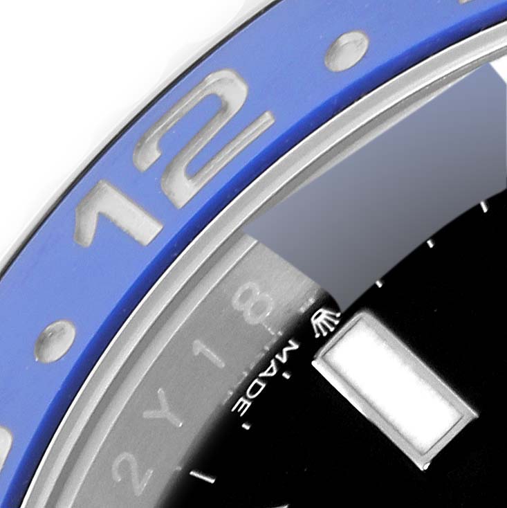 The image shows a close-up angle of the bezel and part of the dial of a Rolex GMT-Master 126710 Men
s Stainless Steel Black Dial 126710 Men
s Stainless Steel Black Dial watch.