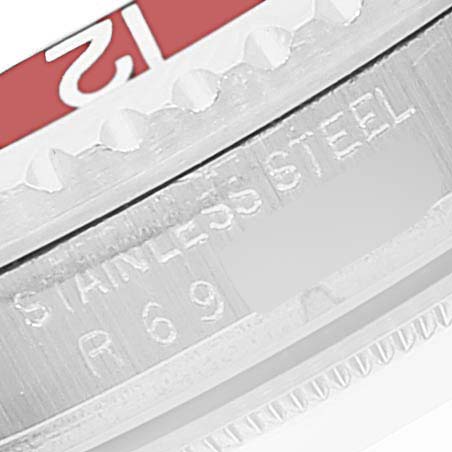 The image shows a close-up of the bezel and outer casing of a Vintage Collection watch by Rolex, focusing on engravings.