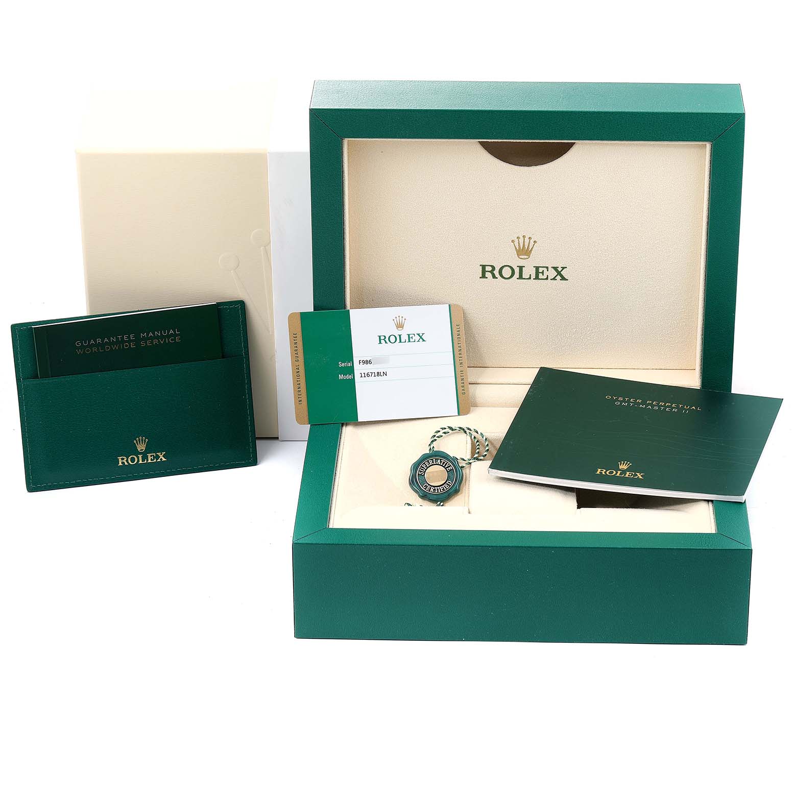 The image shows the packaging, warranty card, booklet, and tags for a Rolex GMT-Master 116718LN Men's Yellow Gold Green Dial 116718LN Men's Yellow Gold Green Dial watch.