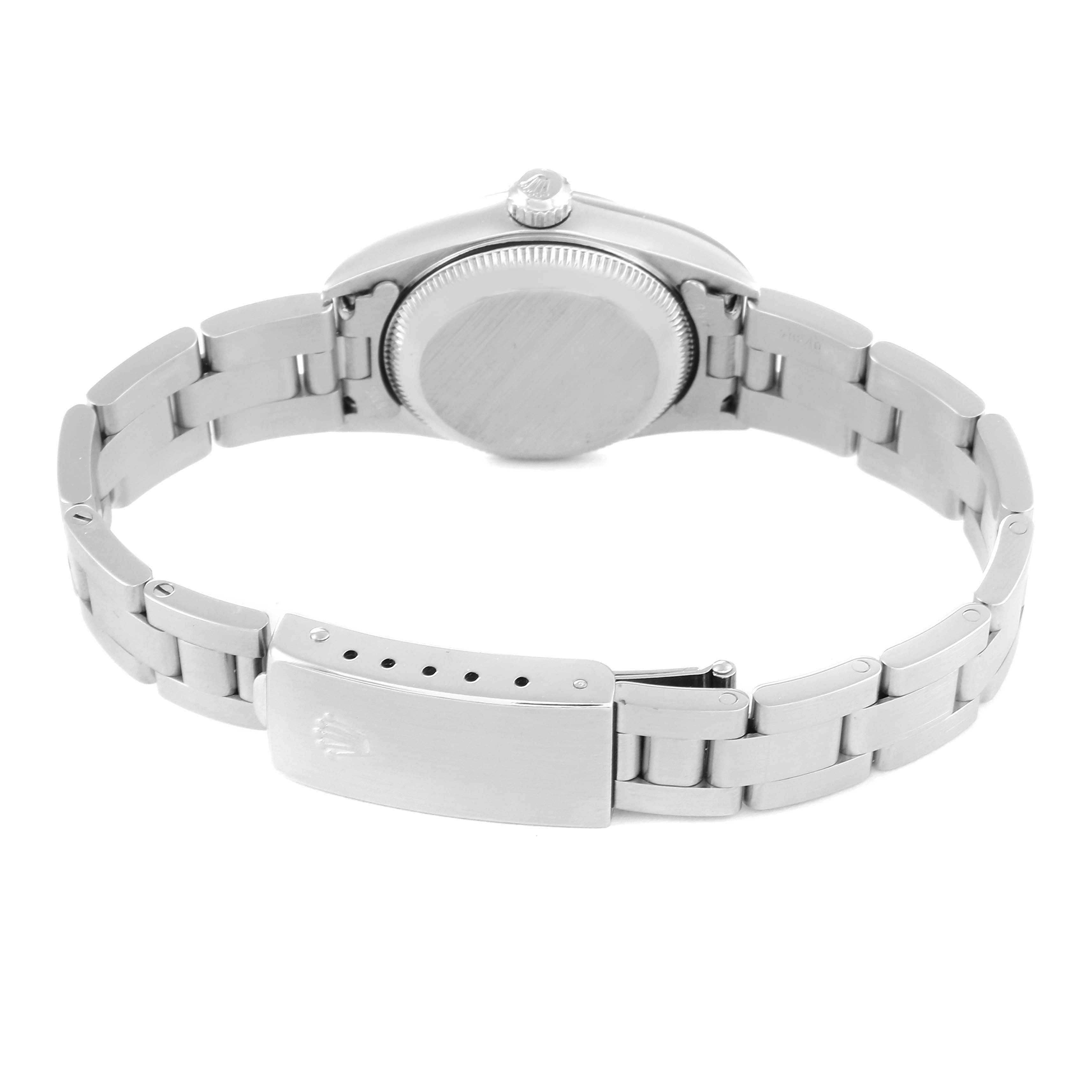 This image shows the back view of a Rolex Oyster Perpetual 76080 Women's Stainless Steel Black Dial 76080 Women's Stainless Steel Black Dial watch, including the case back and the bracelet with the clasp.