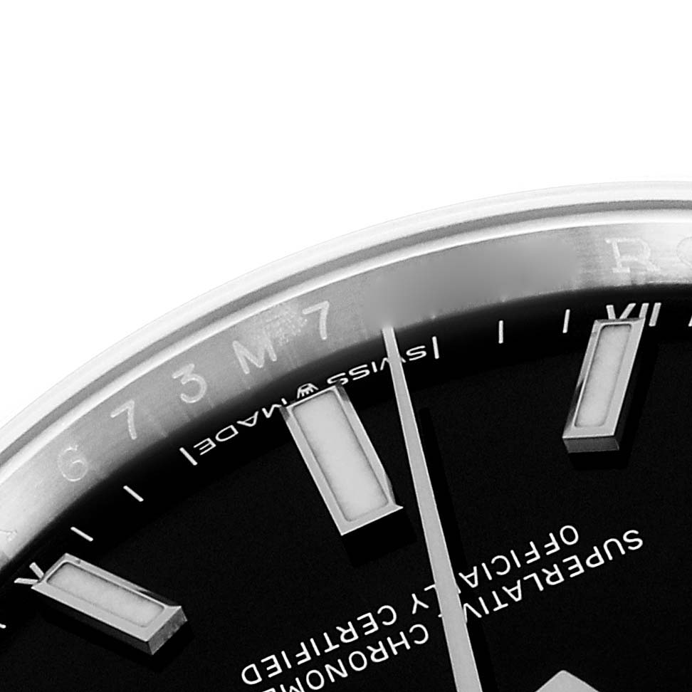 The image shows a close-up of the dial and part of the bezel of a Rolex Oyster Perpetual 124200 Men's Stainless Steel Black Dial 124200 Men's Stainless Steel Black Dial watch.