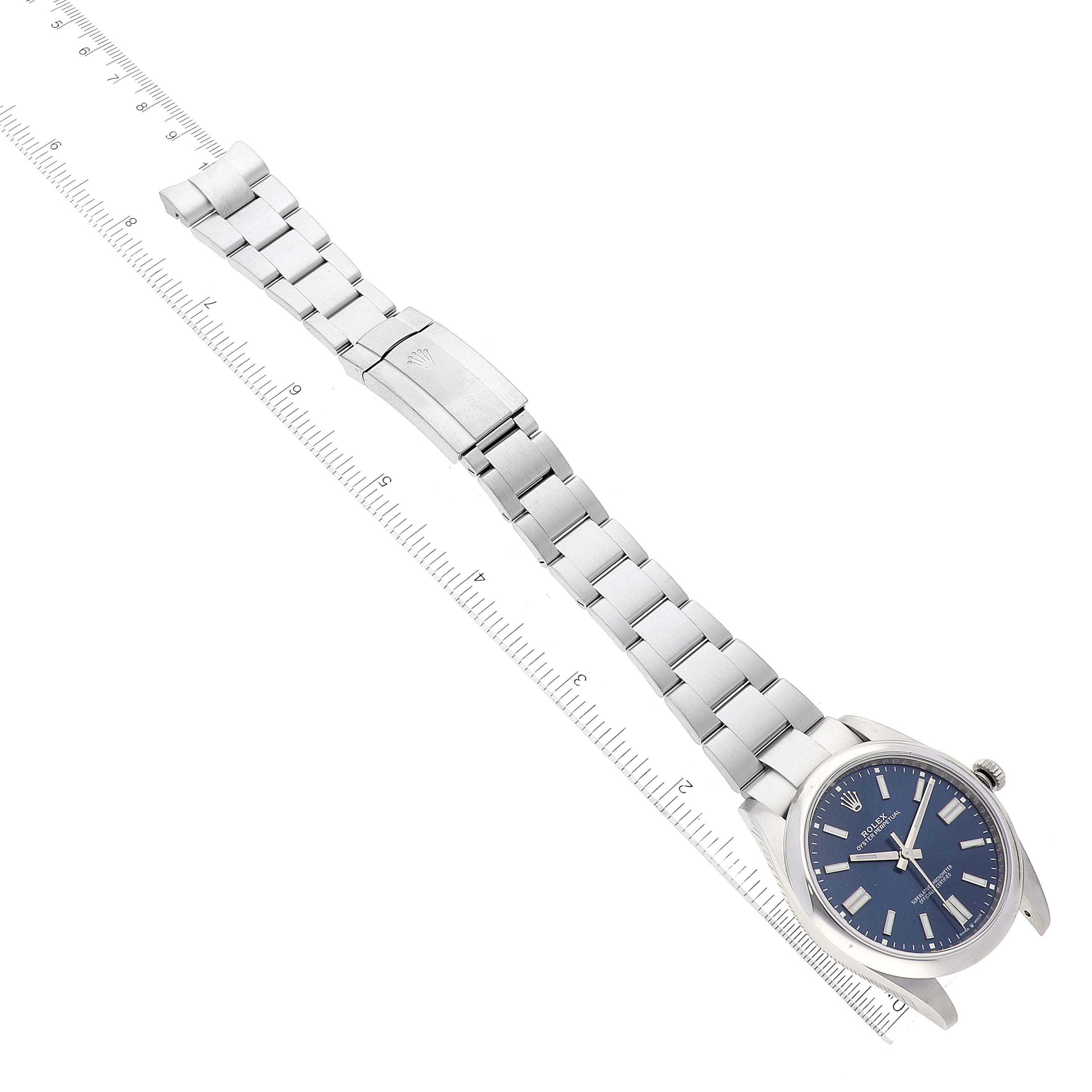 The Rolex Oyster Perpetual 124300 Men
s Stainless Steel Blue Dial 124300 Men
s Stainless Steel Blue Dial watch is shown flat with a clear view of the dial, bracelet, and clasp.