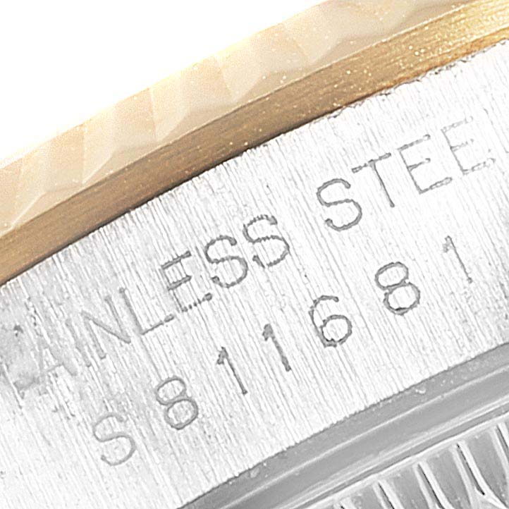 This image shows a close-up of the side of the case with serial engraving on an Oyster Perpetual model by Rolex.