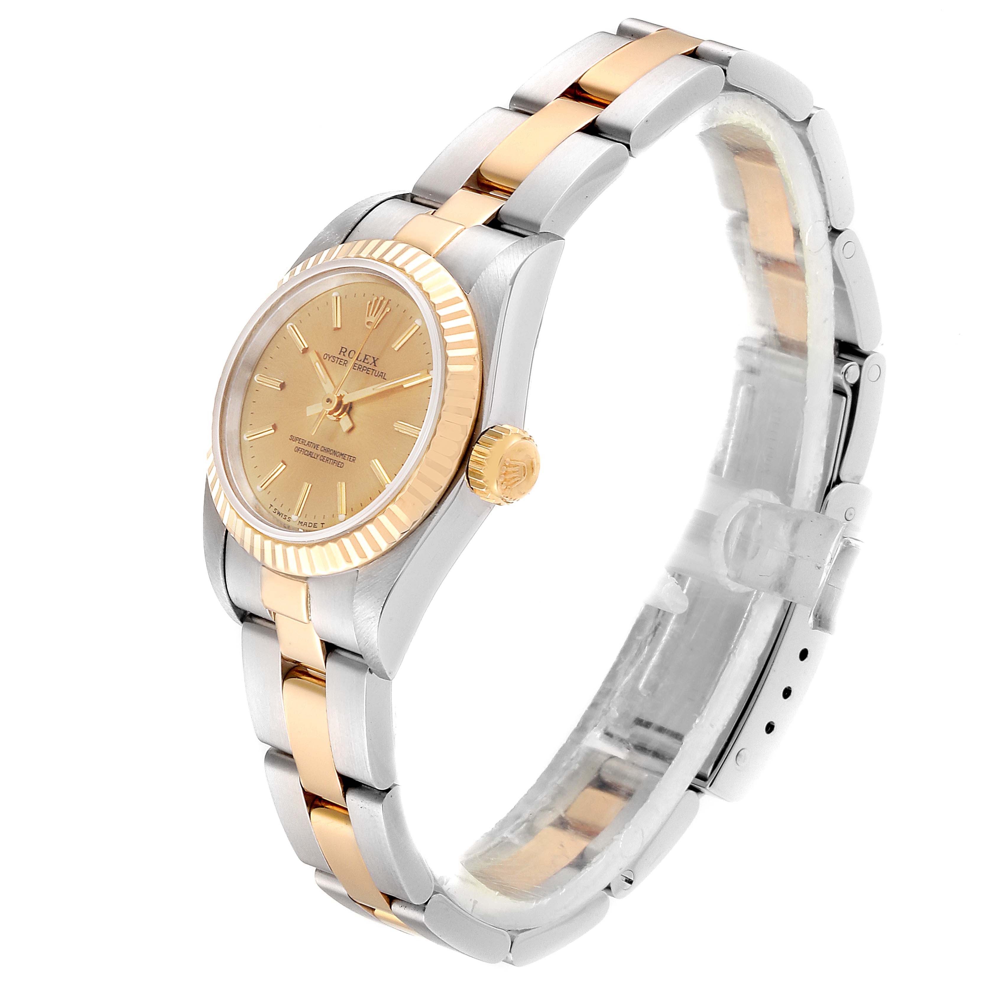 The image shows a Rolex Oyster Perpetual 67193 Women's Steel and Gold (two tone) Champagne Dial 67193 Women's Steel and Gold (two tone) Champagne Dial watch at a three-quarter angle, highlighting the dial, bezel, crown, and two-tone bracelet.