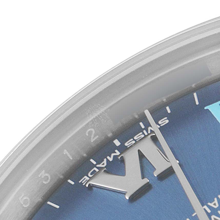The image shows a close-up of the Rolex Mid-Size 177200 Women's Stainless Steel Blue Dial 177200 Women's Stainless Steel Blue Dial watch dial from a top-angle, highlighting the hour markers and the "Swiss Made" text.