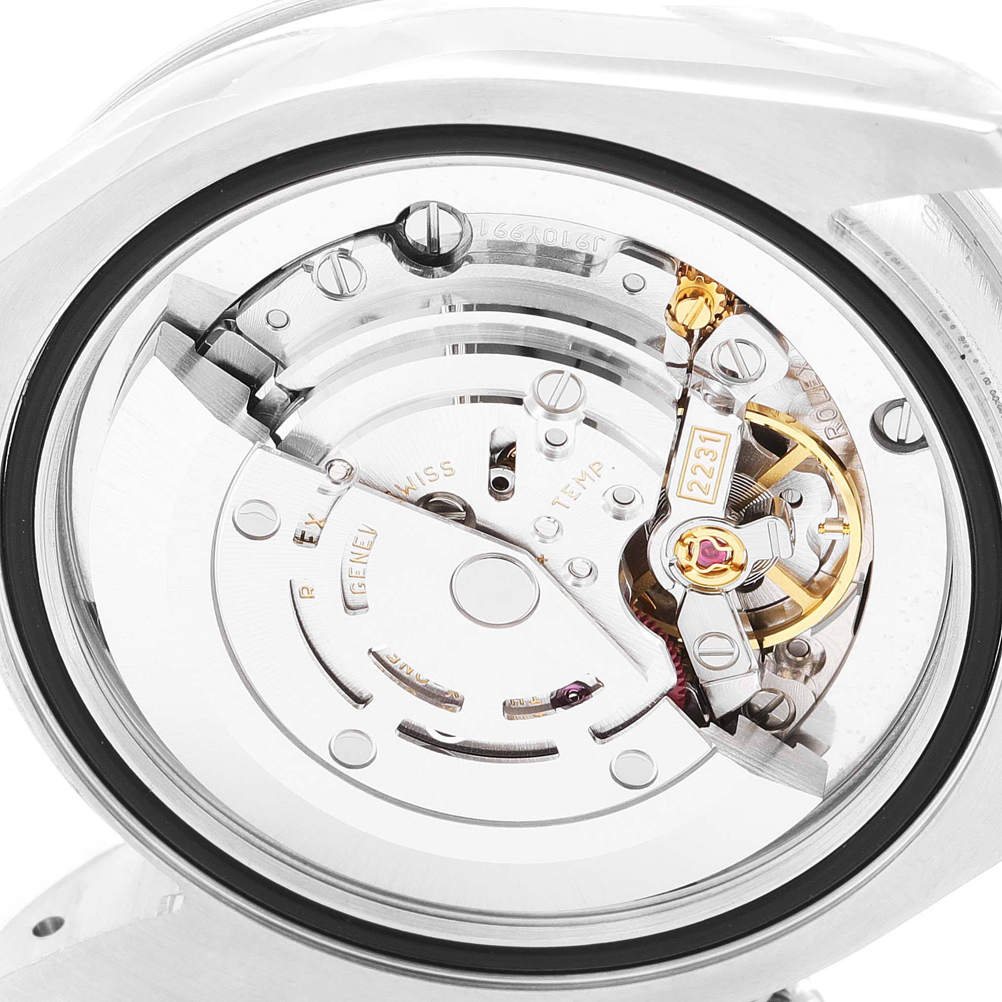 This image shows a detailed view of the movement and internal mechanism of a Mid-Size Rolex watch.