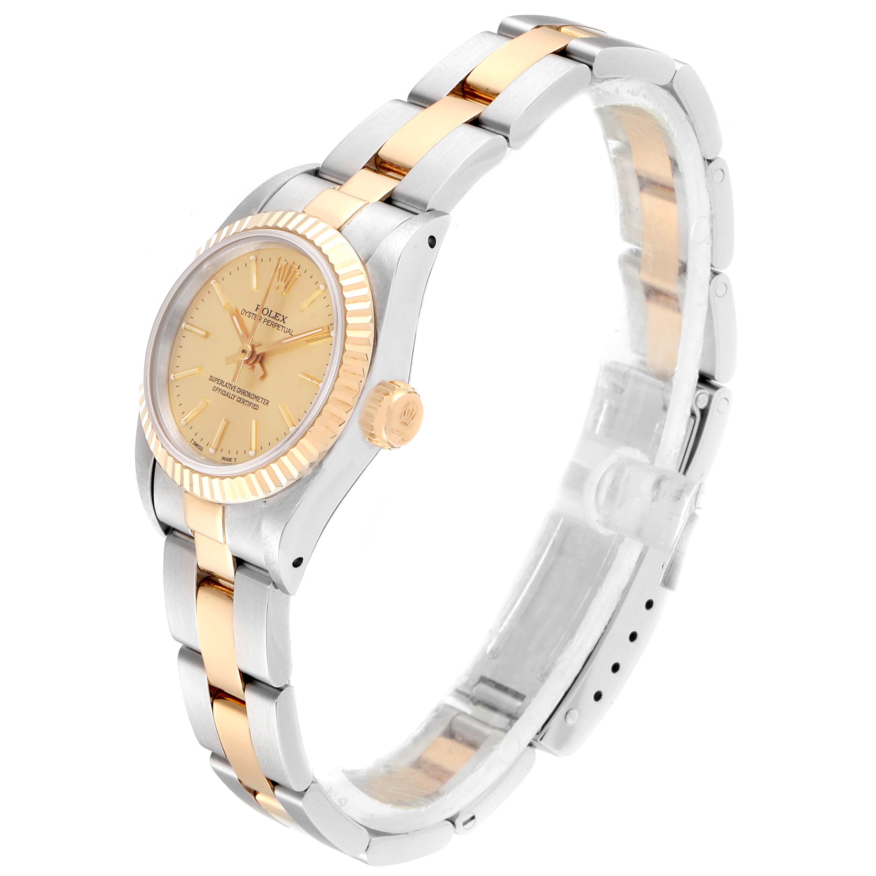 This image shows a side angle of a Rolex Oyster Perpetual 67193 Women's Steel and Gold (two tone) Champagne Dial 67193 Women's Steel and Gold (two tone) Champagne Dial watch, highlighting its case, bezel, crown, and bracelet.