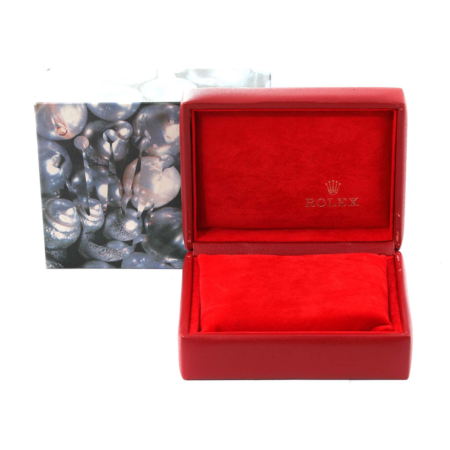 The image shows an open red Rolex box with a cushion, presumably for the President model watch, along with a decorative outer box.