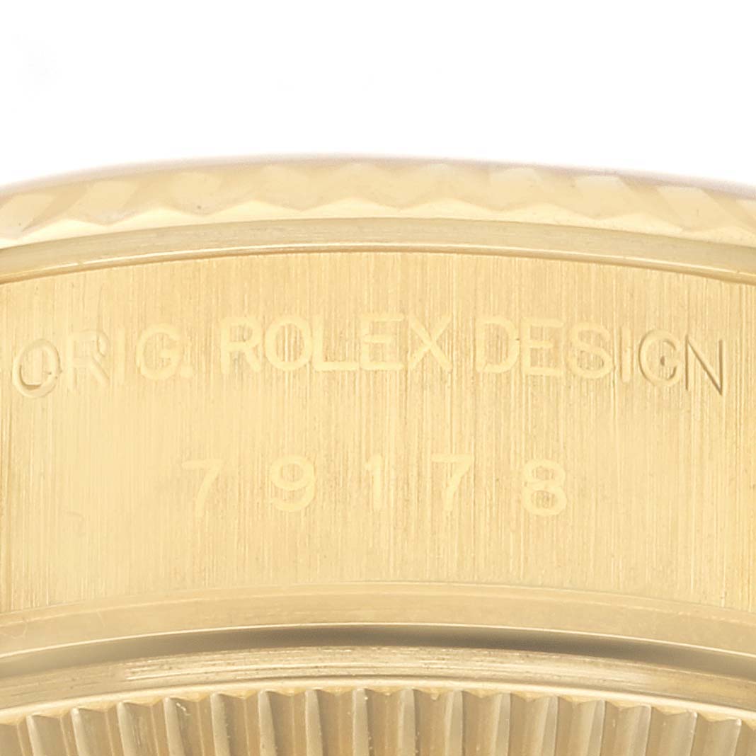 The image shows the engraved side of the Rolex President 79178 Women's Yellow Gold Champagne Dial 79178 Women's Yellow Gold Champagne Dial model, highlighting "ORIG ROLEX DESIGN" and the model number.