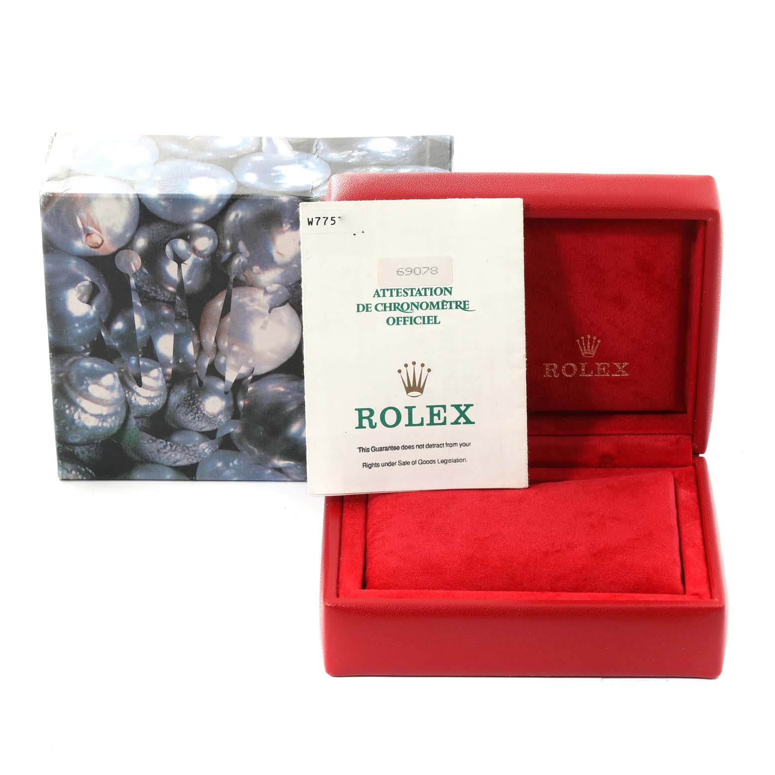 The image shows an open red Rolex watch box, its cover, and an official Rolex document, possibly the certificate.