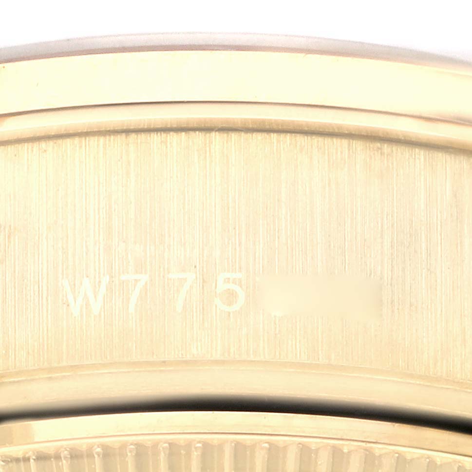 This image shows the serial number engraved on the side of a Rolex President 69078 Women's Yellow Gold Champagne Dial 69078 Women's Yellow Gold Champagne Dial model watch, taken at a close-up angle.