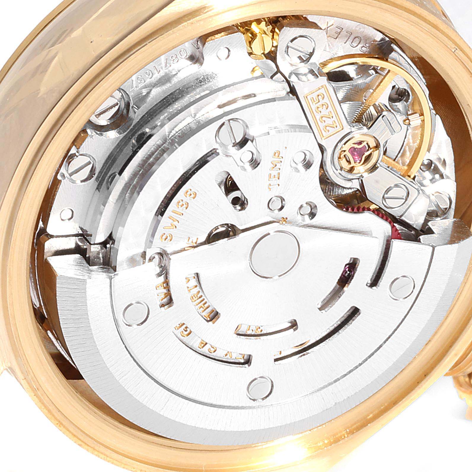 The image shows a close-up view of the movement mechanism of a Rolex President 79178  Women
s Yellow Gold Champagne Dial 79178  Women
s Yellow Gold Champagne Dial model watch.