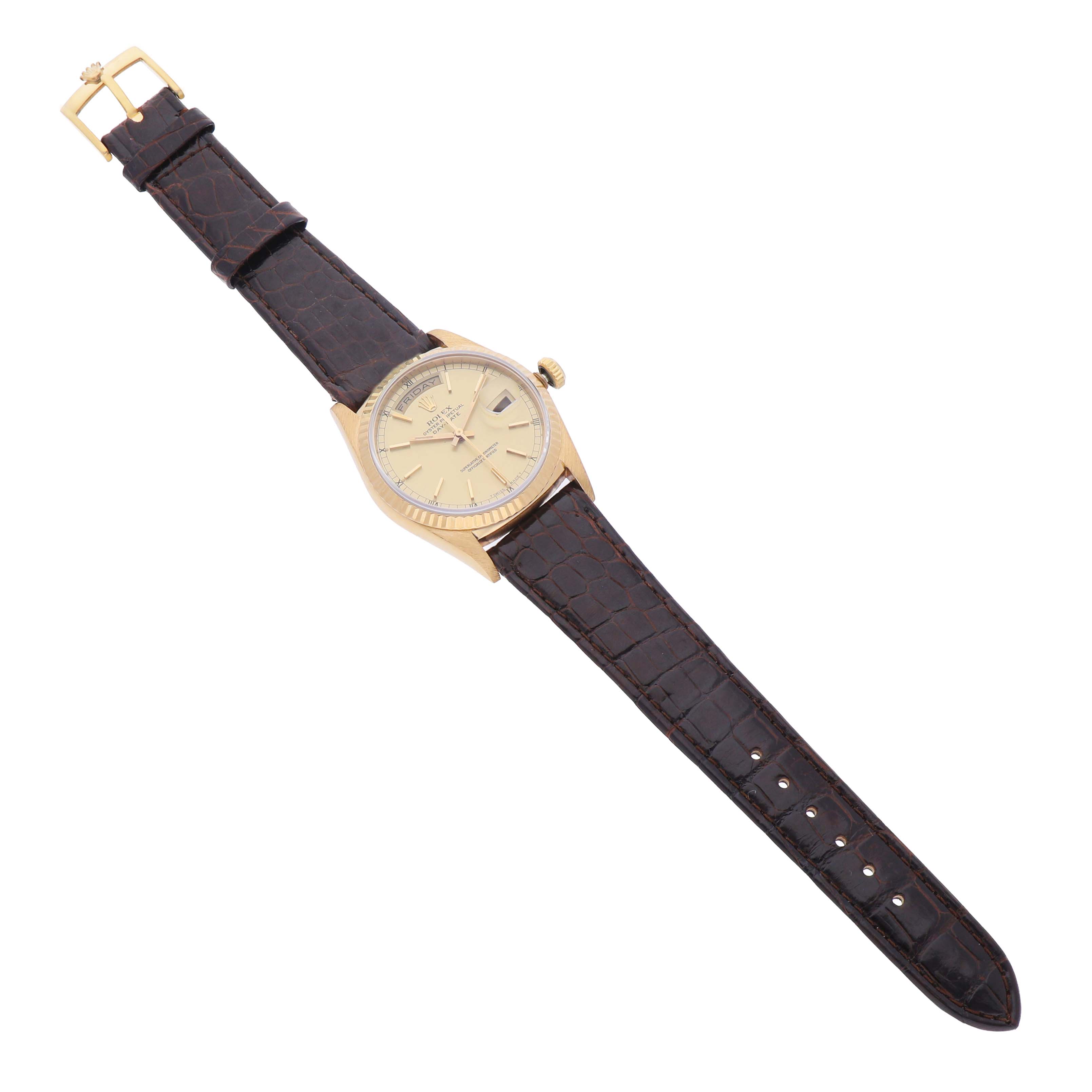 The Rolex President 18238 Mens Yellow Gold Champagne Dial watch is shown from a top-down angle, displaying the dial, case, and leather strap.