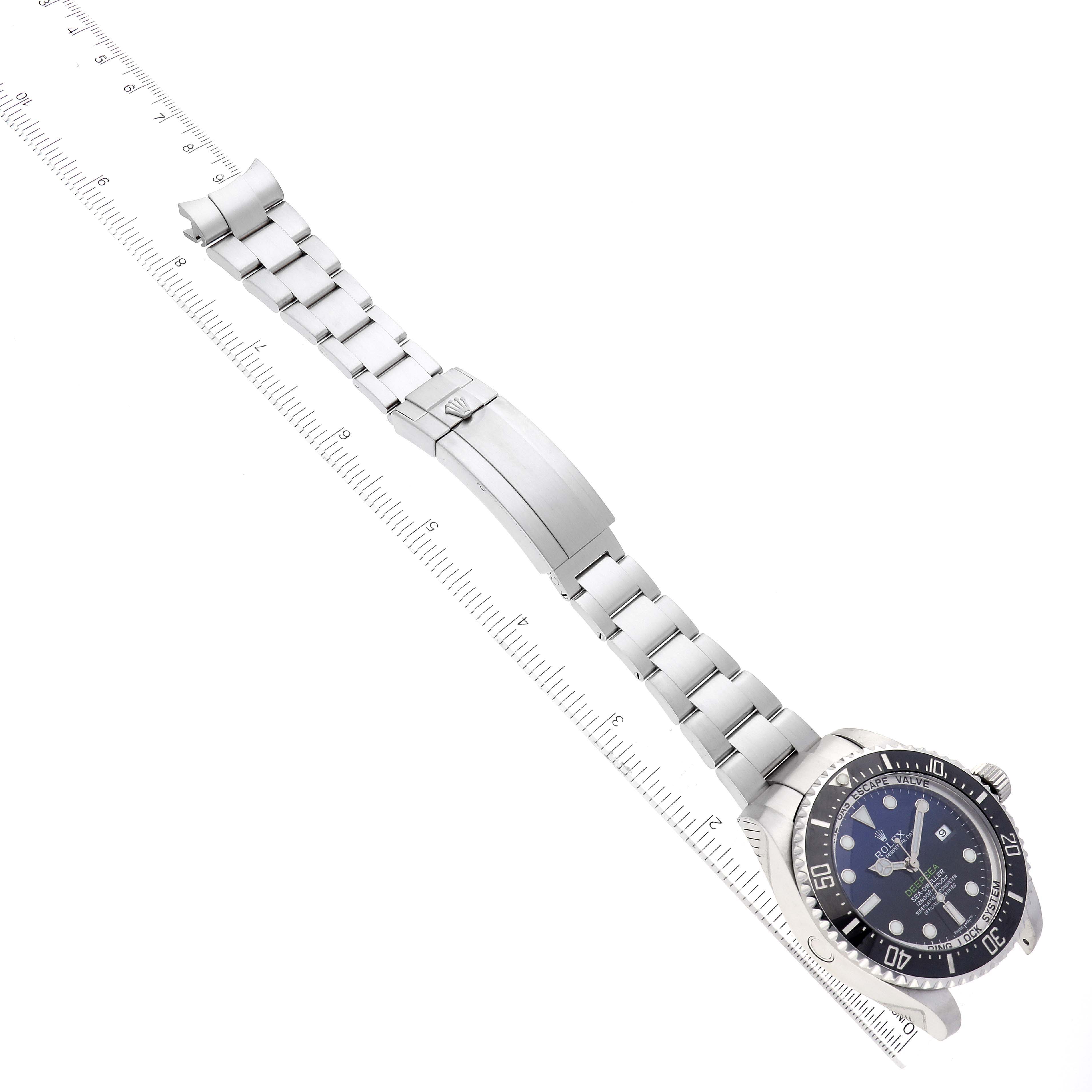 The image shows a Rolex Sea-Dweller 116660 Men's Stainless Steel Blue Dial 116660 Men's Stainless Steel Blue Dial watch laid flat, showcasing the dial, bezel, crown, and stainless steel bracelet with clasp.