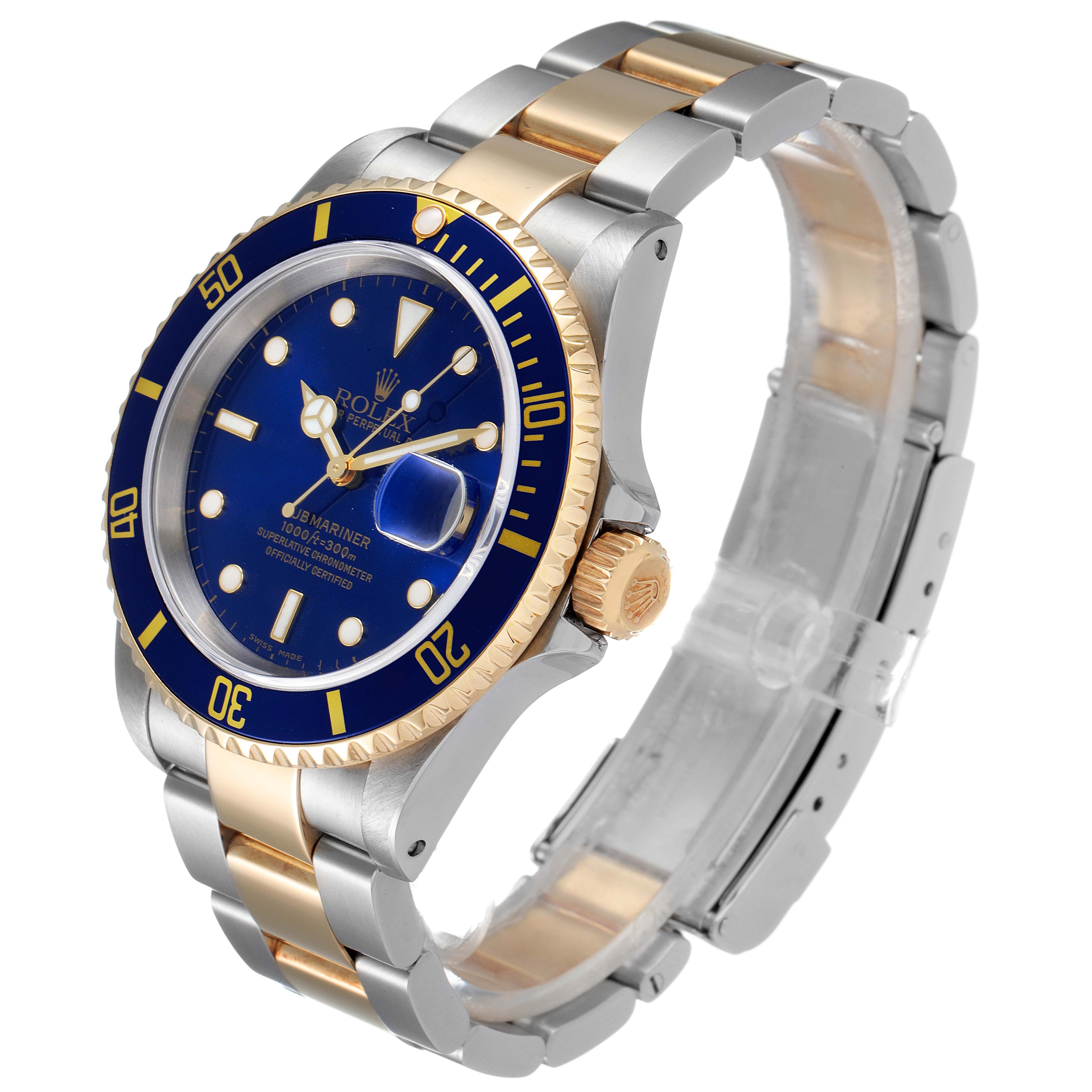 This image shows the Rolex Submariner 16613 Men
s Steel and Gold (two tone) Blue Dial 16613 Men
s Steel and Gold (two tone) Blue Dial watch at a three-quarter view, highlighting the blue dial, bezel, and two-tone bracelet.