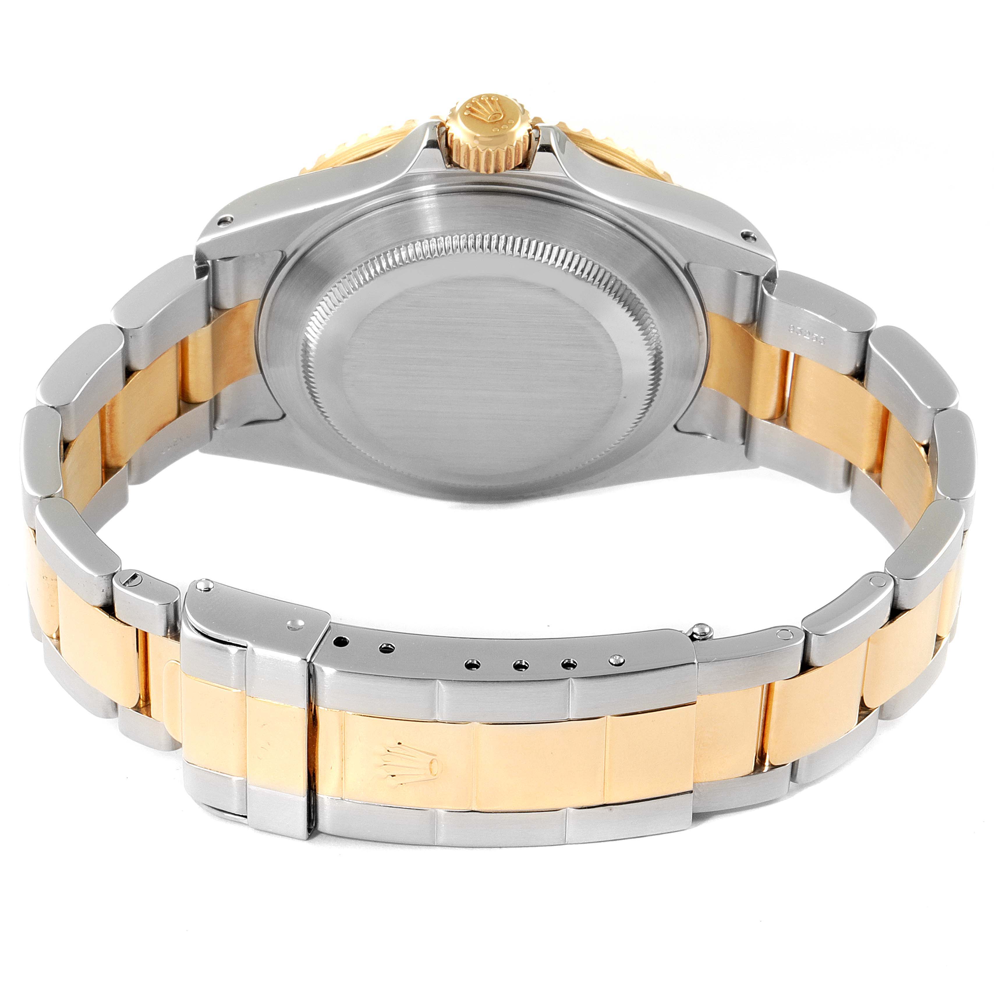 The image shows the back case, crown, and bracelet of a Rolex Submariner 16613 Men
s Steel and Gold (two tone) Blue Dial 16613 Men
s Steel and Gold (two tone) Blue Dial watch from a rear angle.