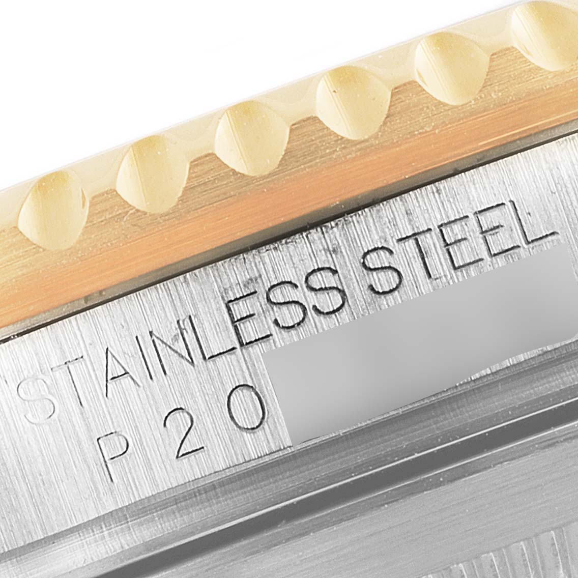 This is a close-up of the case back and bezel area of a Rolex Submariner 16613 Men
s Steel and Gold (two tone) Blue Dial 16613 Men
s Steel and Gold (two tone) Blue Dial watch, showing "Stainless Steel" engraving.