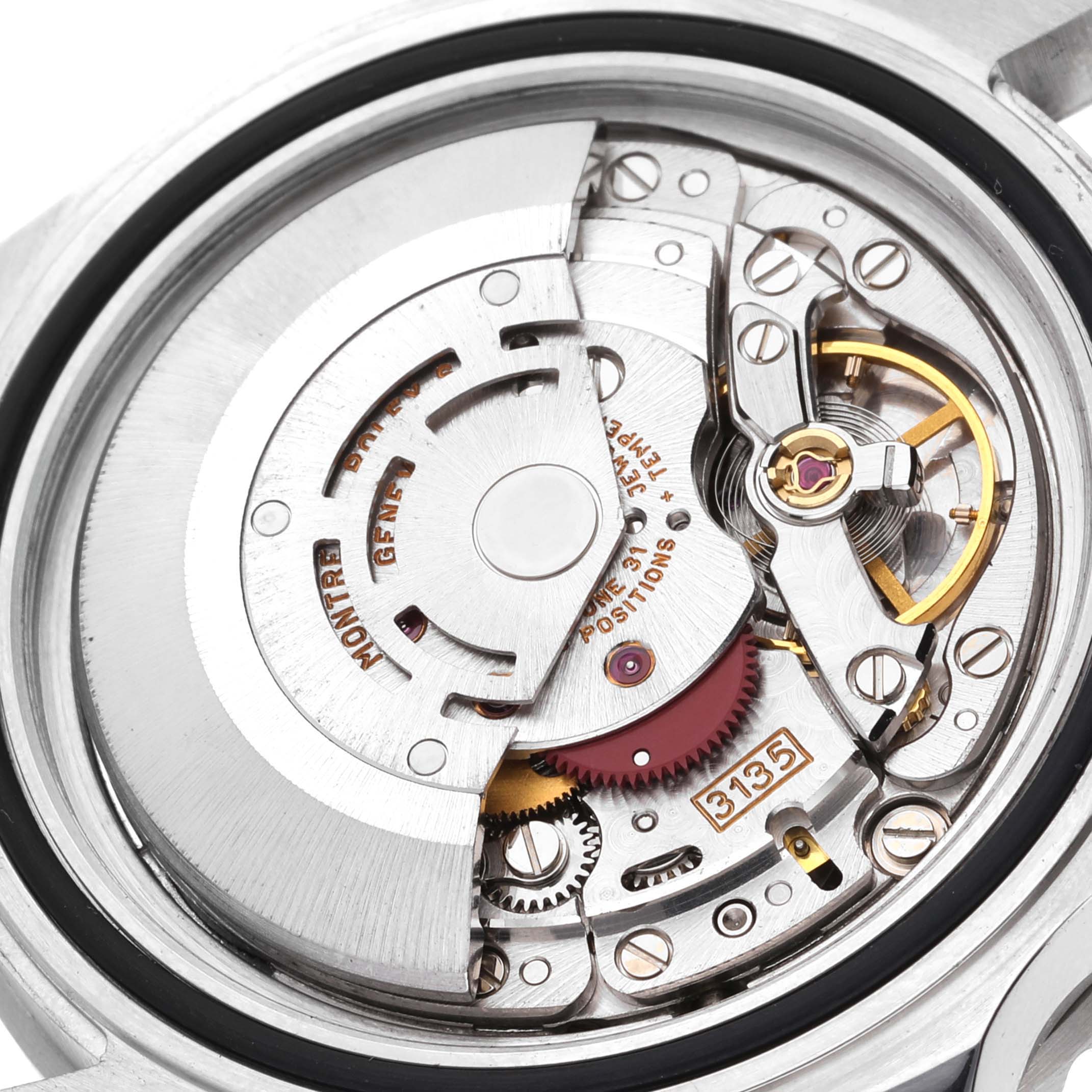 This image shows a close-up view of the movement mechanism inside a Rolex Submariner 16610 Men
s Stainless Steel Black Dial 16610 Men
s Stainless Steel Black Dial watch.