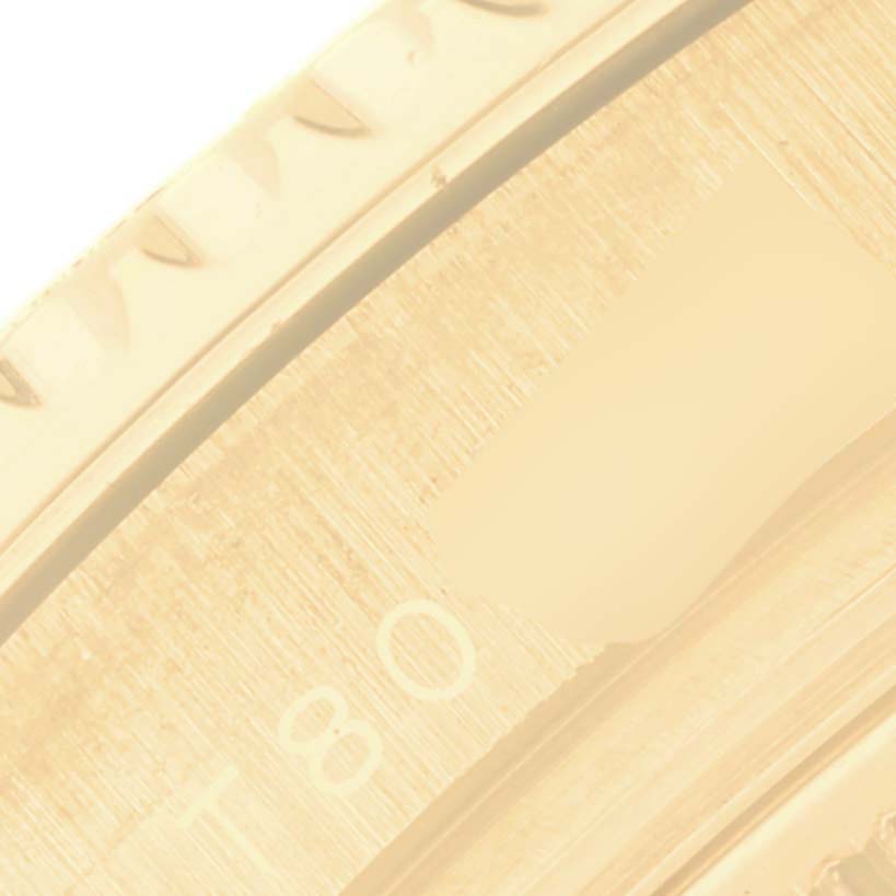 The image shows a close-up of the bezel and part of the dial of a Rolex Yacht-Master 68628 Men's Yellow Gold White Dial 68628 Men's Yellow Gold White Dial watch.