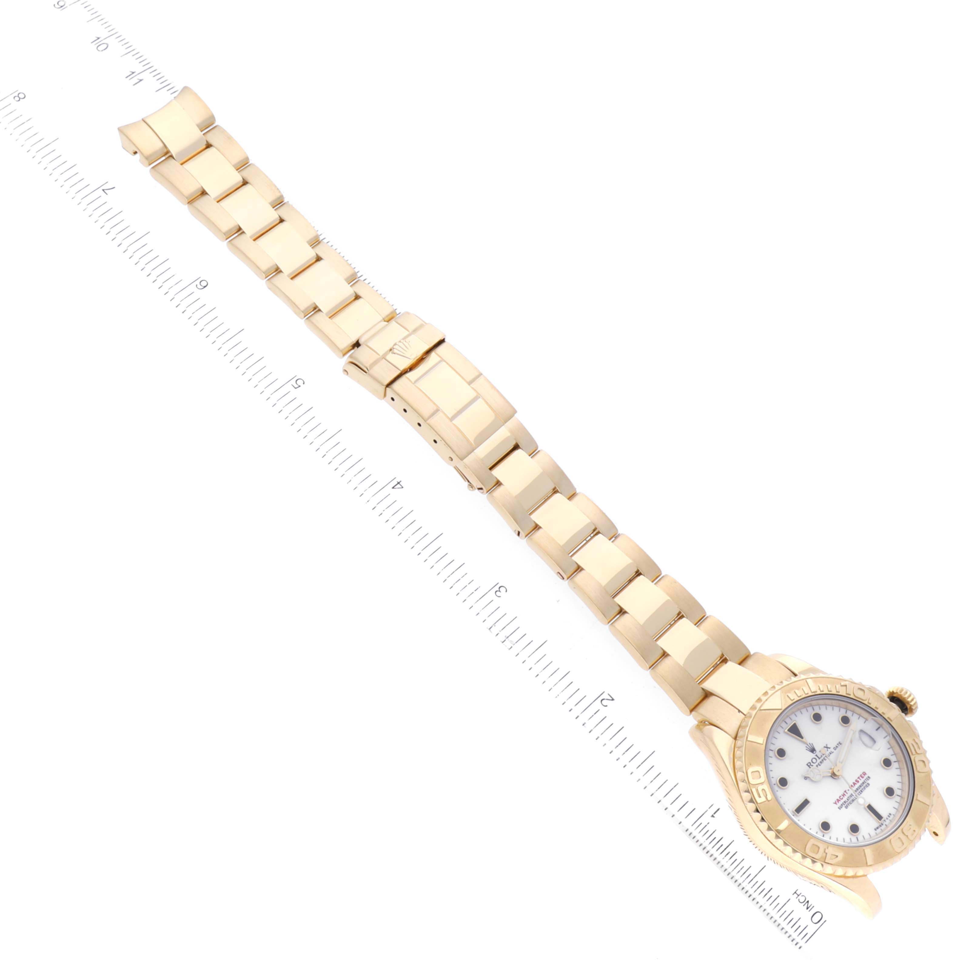 This image shows the Rolex Yacht-Master 68628 Men's Yellow Gold White Dial 68628 Men's Yellow Gold White Dial watch from an overhead angle, displaying its full bracelet and the watch face.