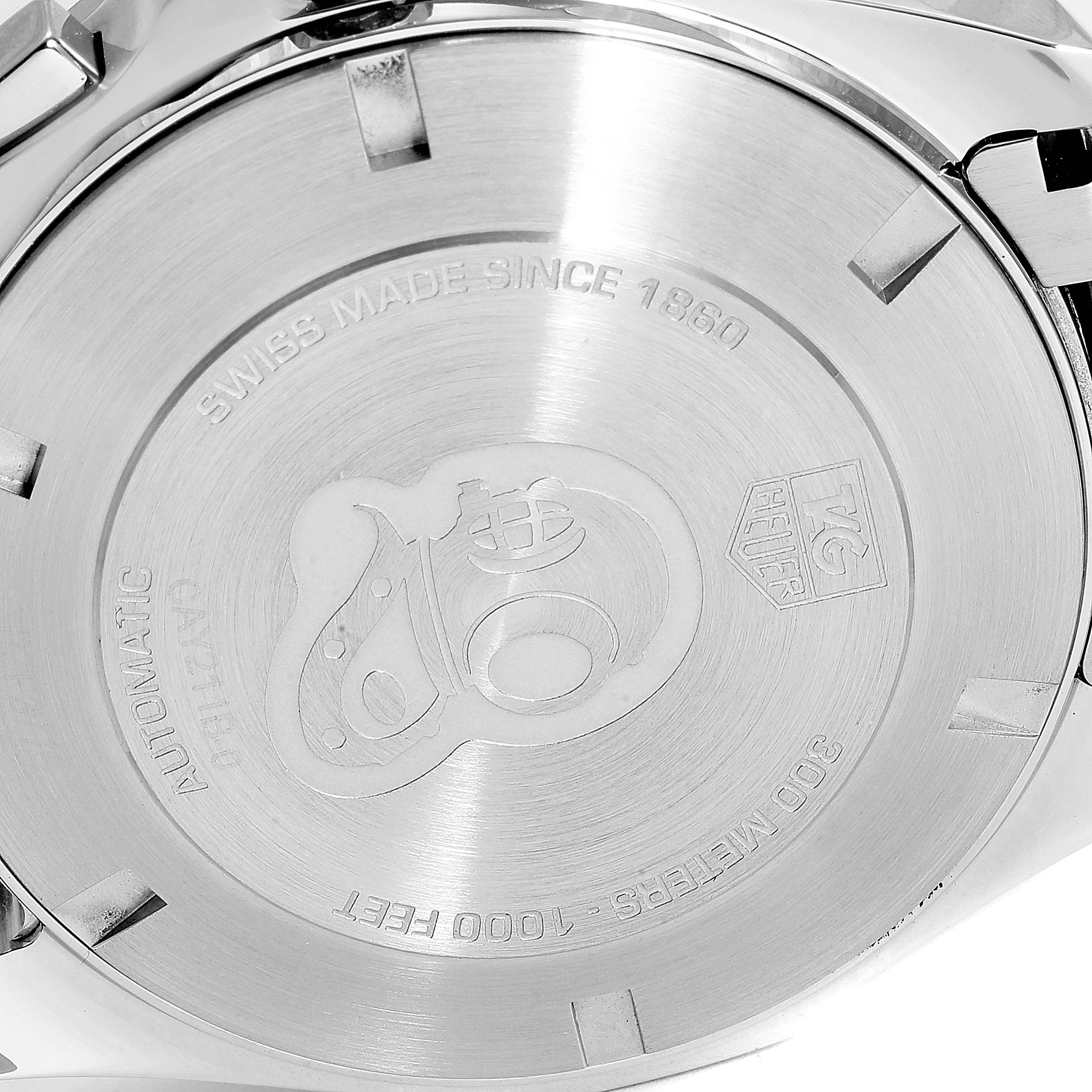 The image shows the back case of a Tag Heuer Aquaracer CAY211B.BA0927  Men's Stainless Steel Blue Dial CAY211B.BA0927  Men's Stainless Steel Blue Dial watch, engraved with branding and specifications.