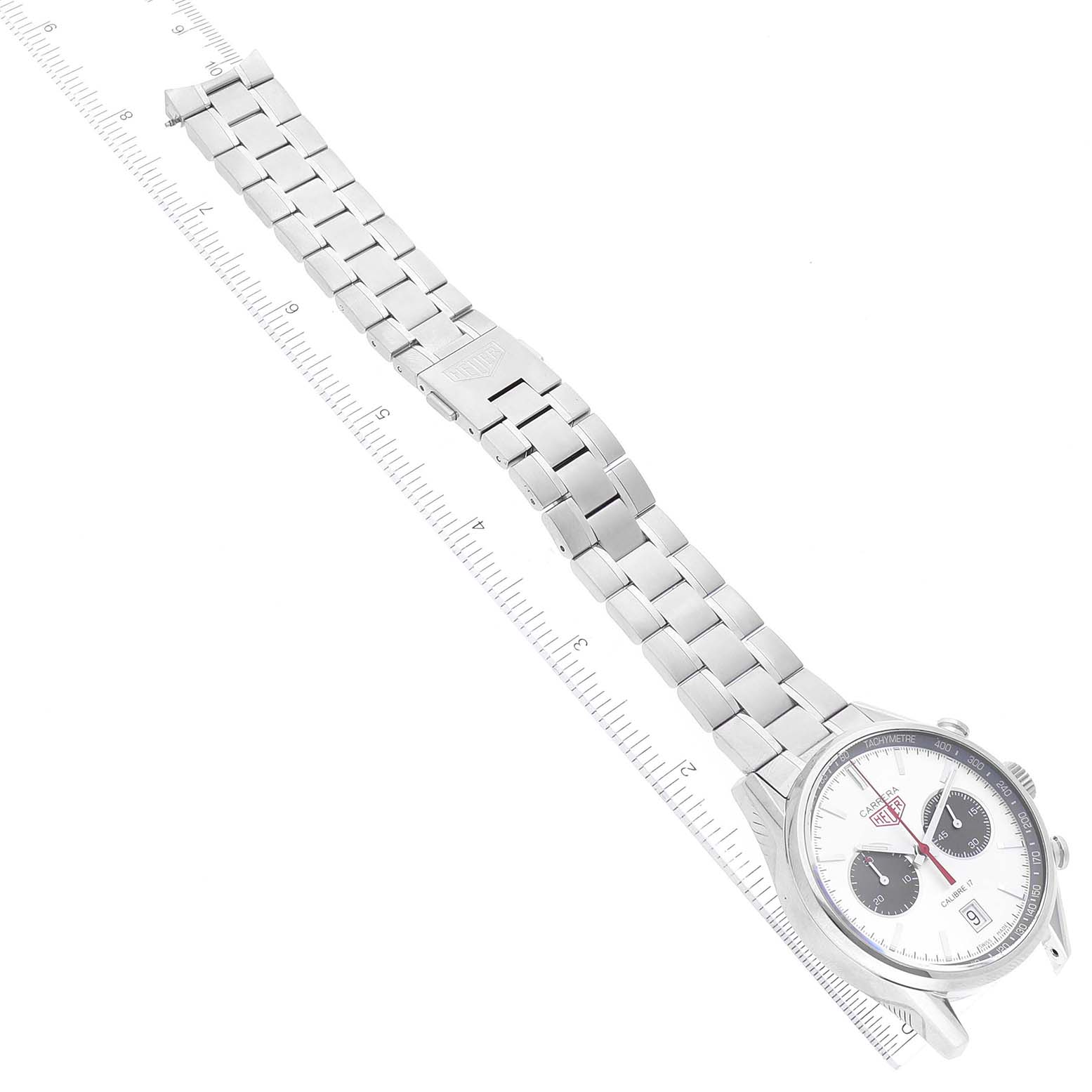 The image shows a top view of the Tag Heuer Limited Edition watch, focusing on its face, bezel, and metal bracelet.