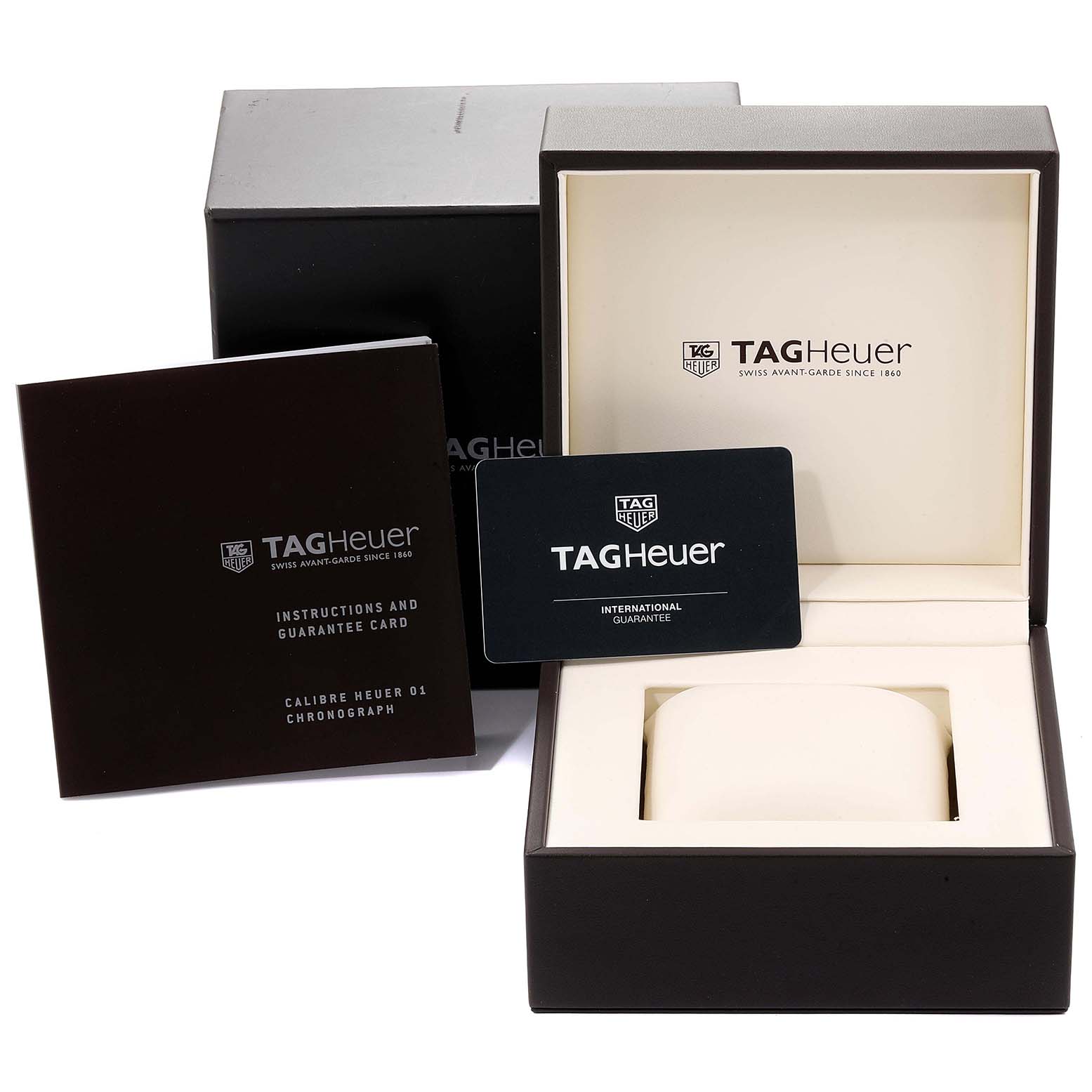 The image shows the Tag Heuer Carrera CAR2A1T.FT6052 Men's Titanium Black Dial CAR2A1T.FT6052 Men's Titanium Black Dial watch box, instruction manual, and guarantee card from a front angle.