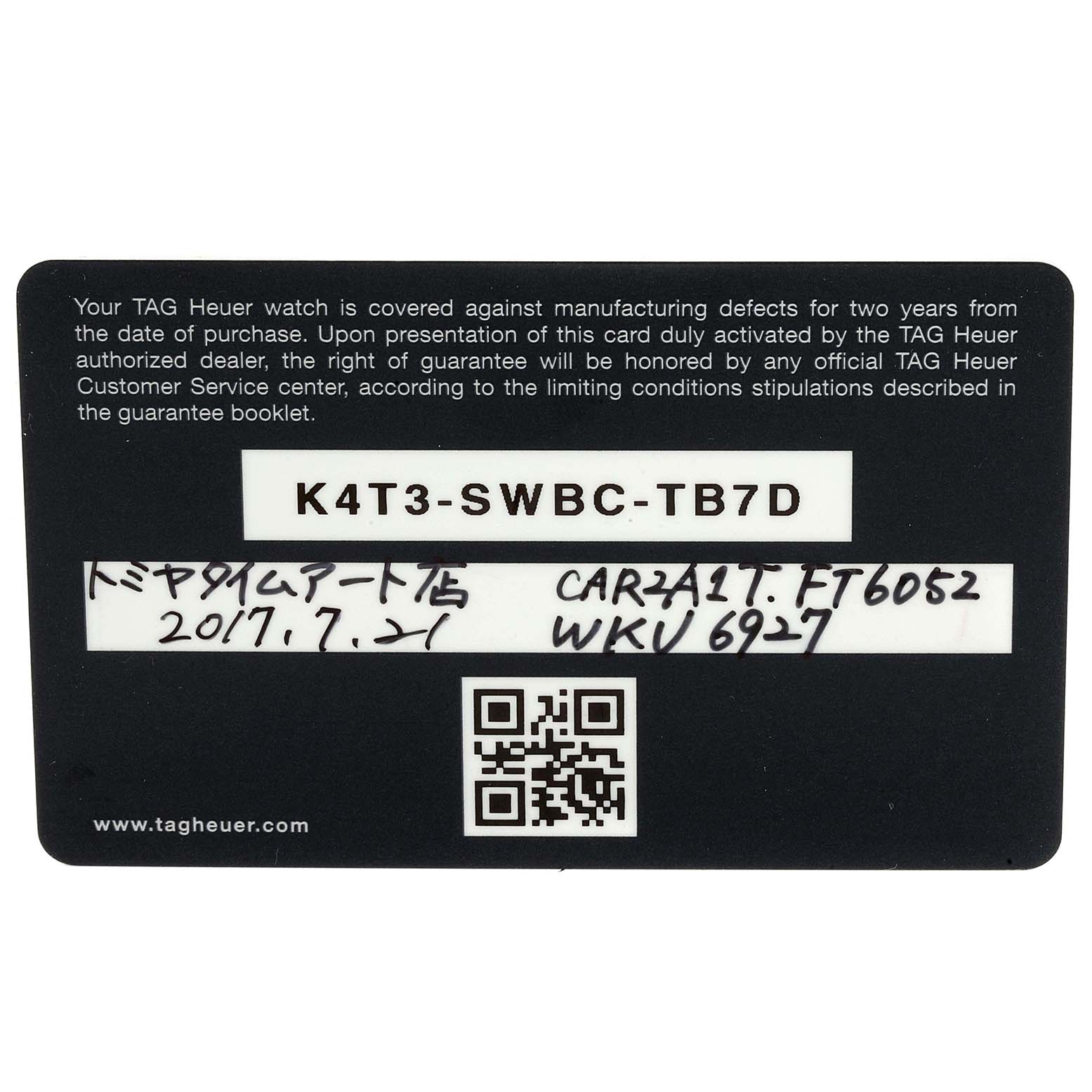 This is a warranty card for the Tag Heuer Carrera CAR2A1T.FT6052 Men's Titanium Black Dial CAR2A1T.FT6052 Men's Titanium Black Dial model, shown from a top-down angle.
