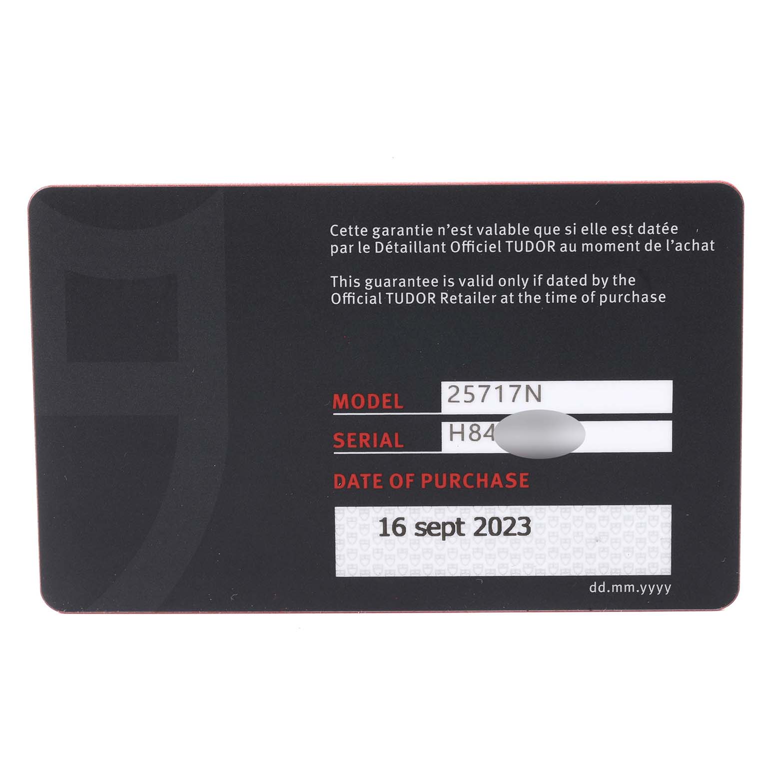 This image shows the warranty card for a Tudor Pelagos M25717N-0001 Men
s Titanium Black Dial M25717N-0001 Men
s Titanium Black Dial model watch, displaying the model number, serial number, and purchase date.