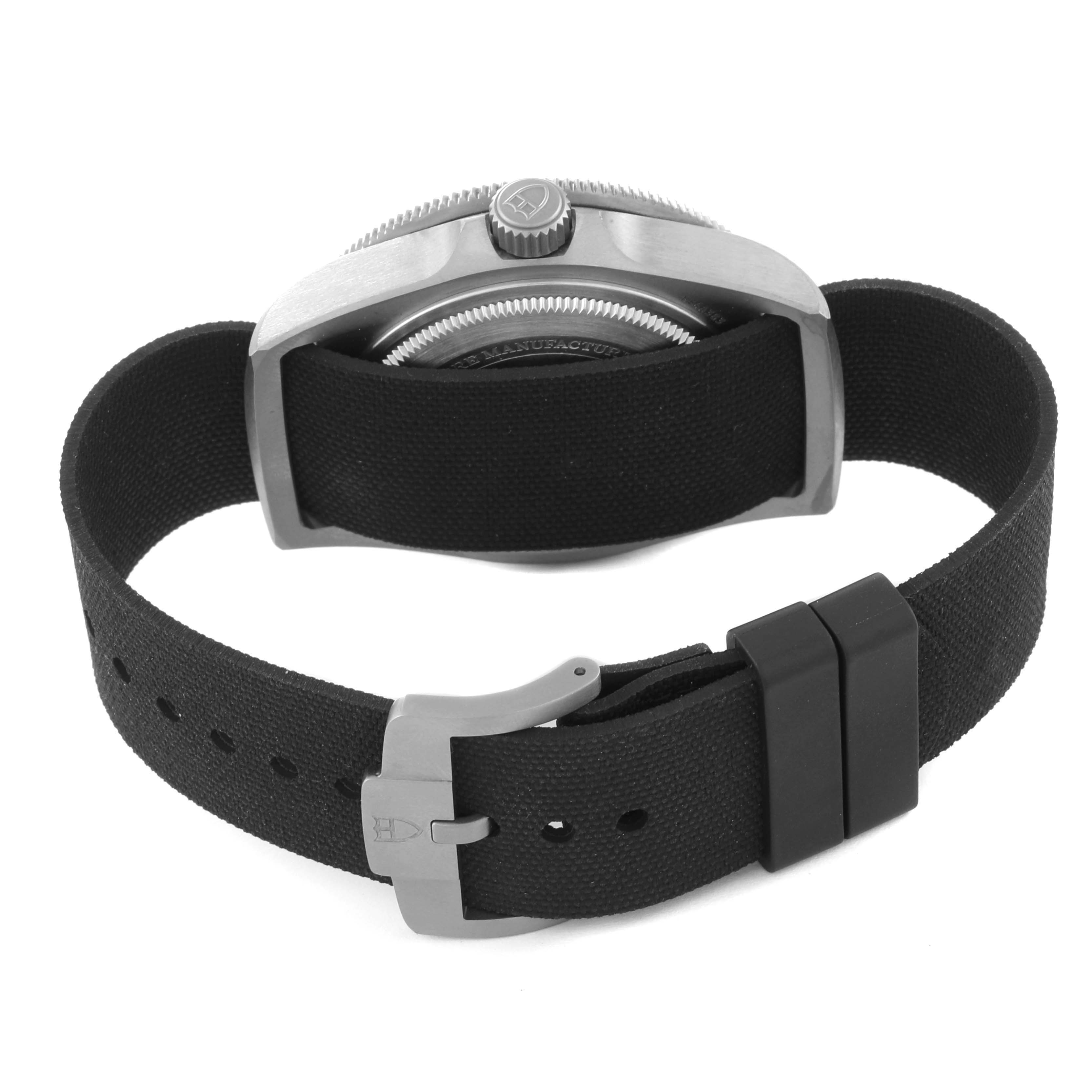 The Tudor Pelagos M25717N-0001 Men
s Titanium Black Dial M25717N-0001 Men
s Titanium Black Dial watch is shown from the side, displaying the caseback, crown, and black strap with a buckle.