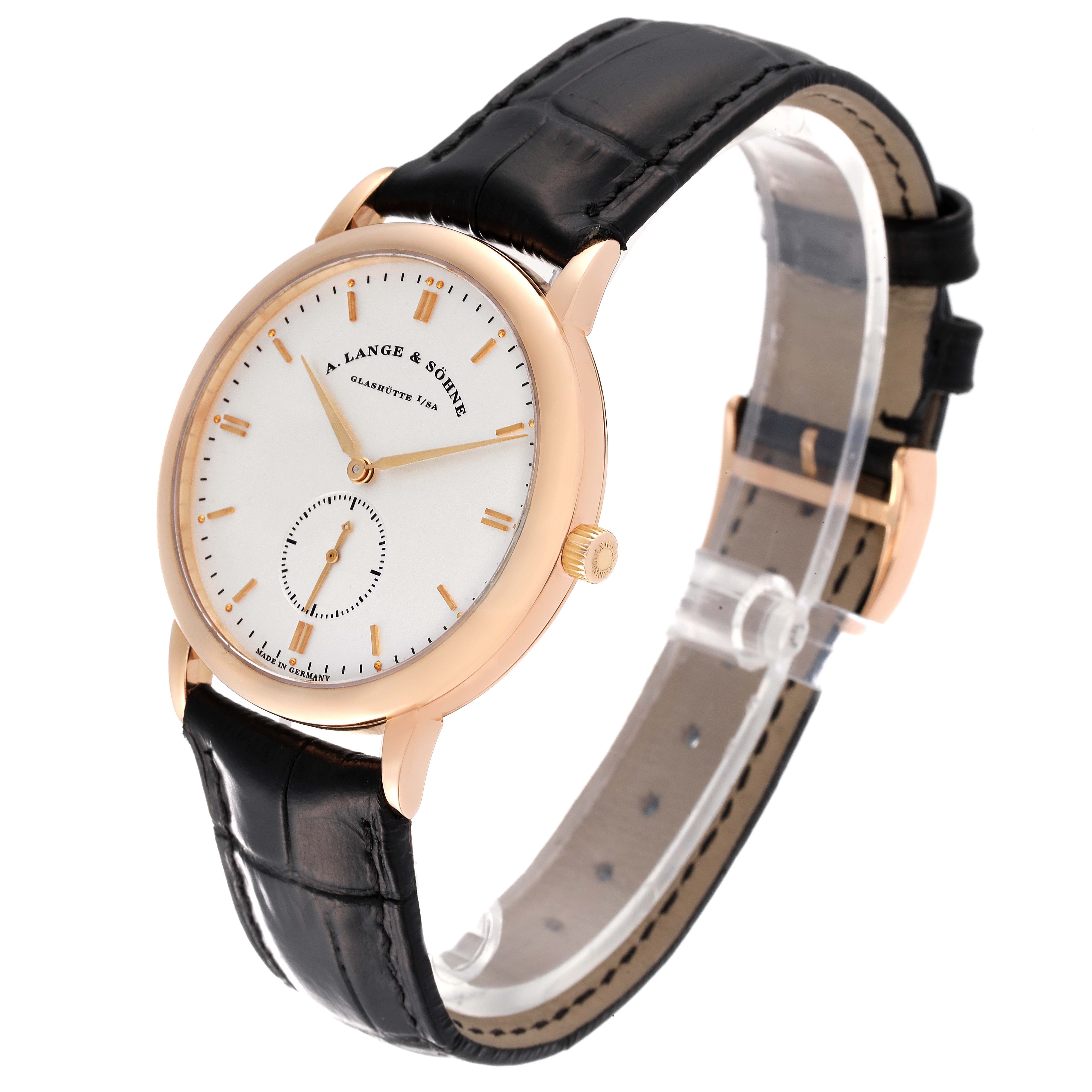 The image shows a Saxonia model by A. Lange & Söhne at a slight right angle, displaying the watch face, case, crown, and leather strap.