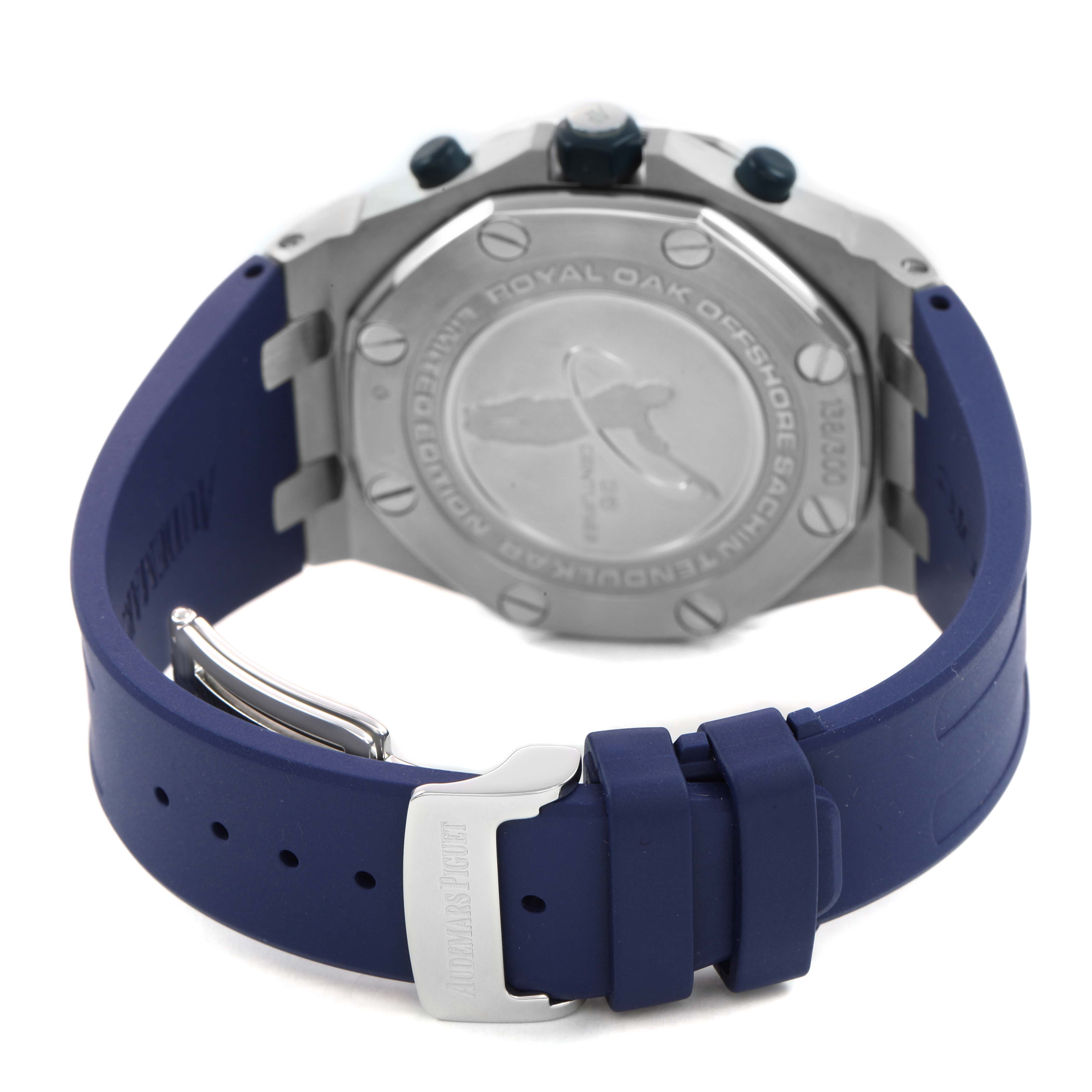 The Audemars Piguet Royal Oak Offshore 26182ST Men's Stainless Steel White Dial watch is shown from the back, displaying the case back, strap, and clasp.