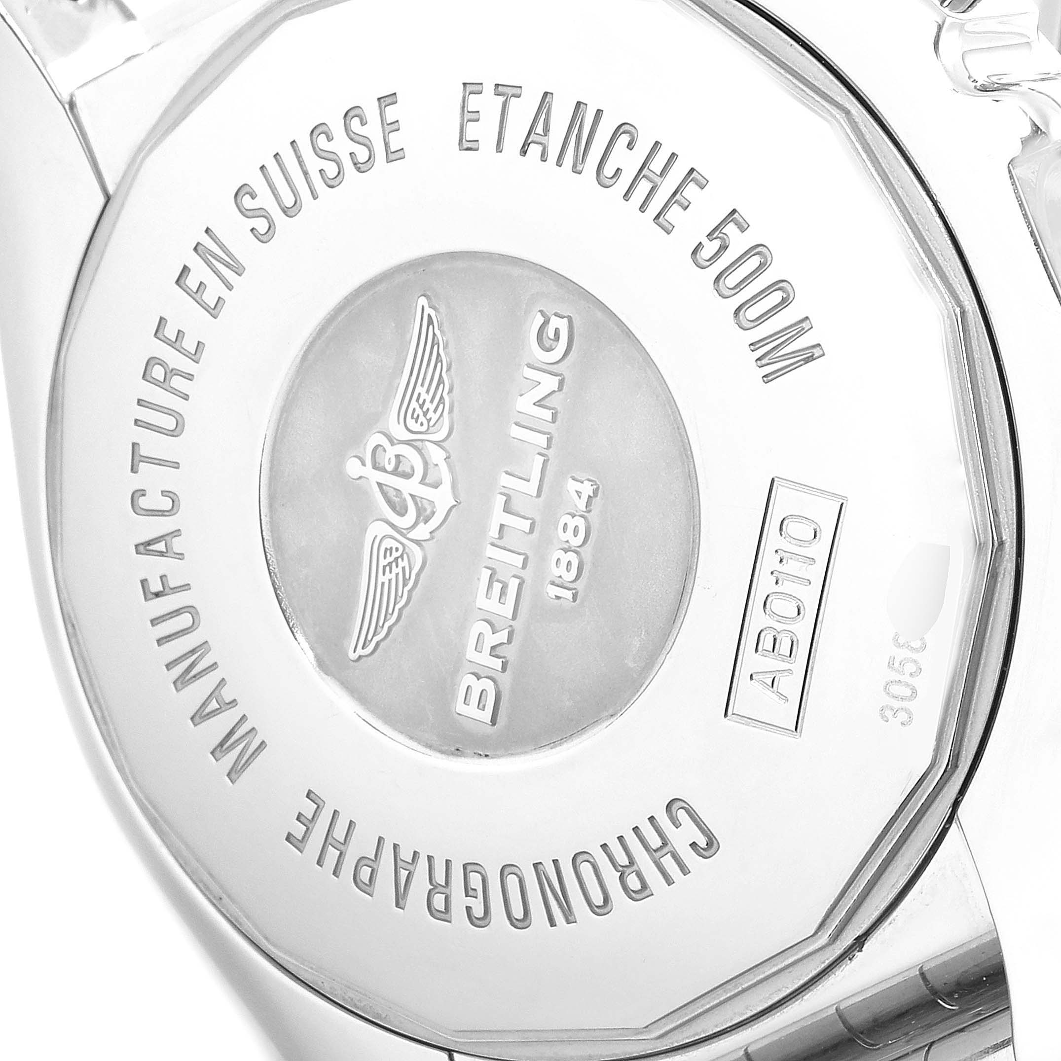 The image shows the back case of a Breitling Chronomat AB0110 Men's Stainless Steel Black Dial AB0110 Men's Stainless Steel Black Dial watch, highlighting its text engravings and branding.