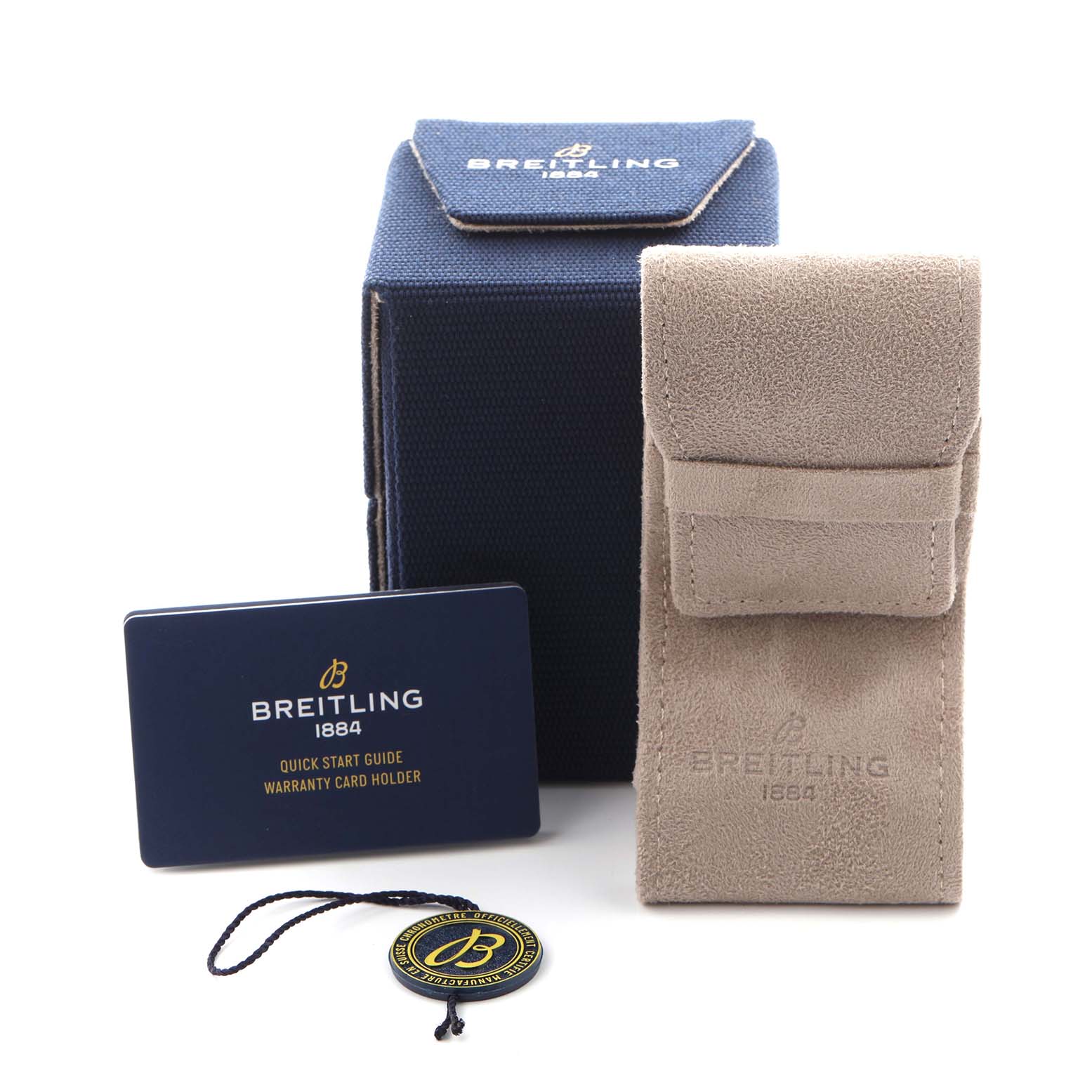 The image shows accessories for a Breitling Aviator Y233801A1B1A1 Men
s Stainless Steel Black Dial Y233801A1B1A1 Men
s Stainless Steel Black Dial watch, including a case, suede pouch, warranty card, and hang tag.