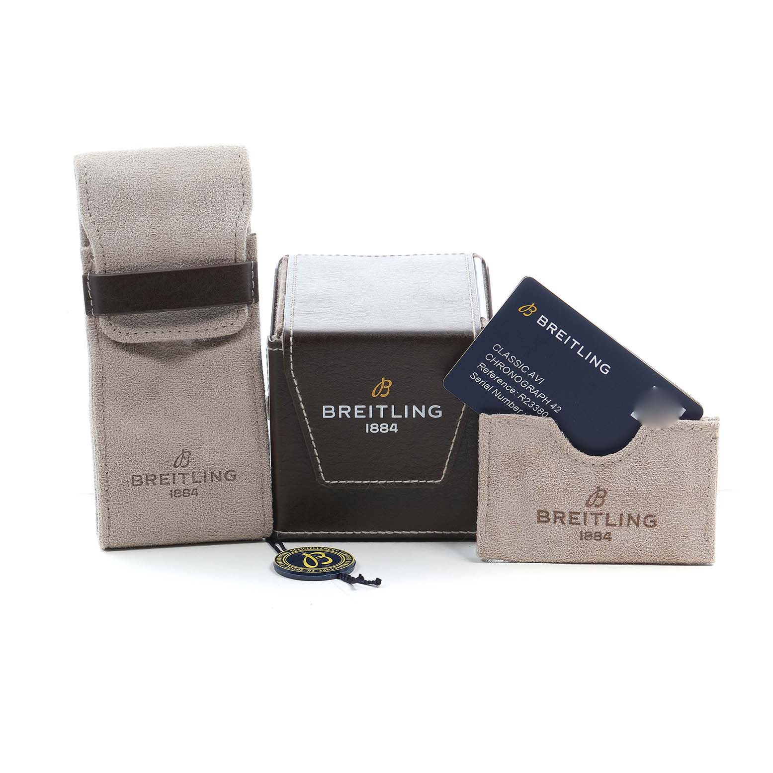 The image shows Breitling Aviator R23380 Men's Rose Gold Grey Dial watch accessories including a box, pouch, warranty card, and tag from a front angle.