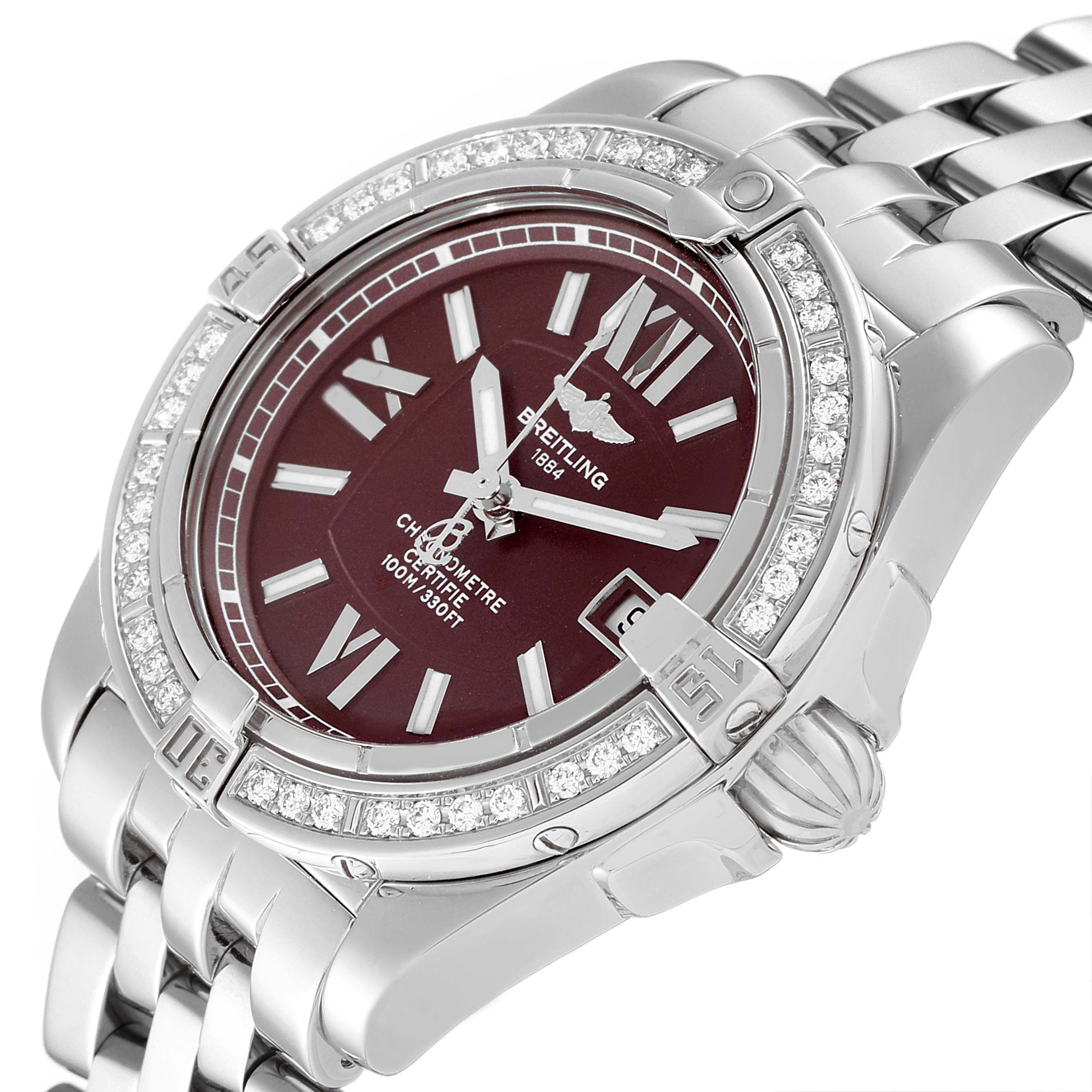 The image shows a side angle of the Breitling A17356 Women's Stainless Steel Burgundy Dial A17356 Women's Stainless Steel Burgundy Dial Cockpit Chronometer A17356, highlighting its burgundy dial, diamond bezel, and stainless steel bracelet.