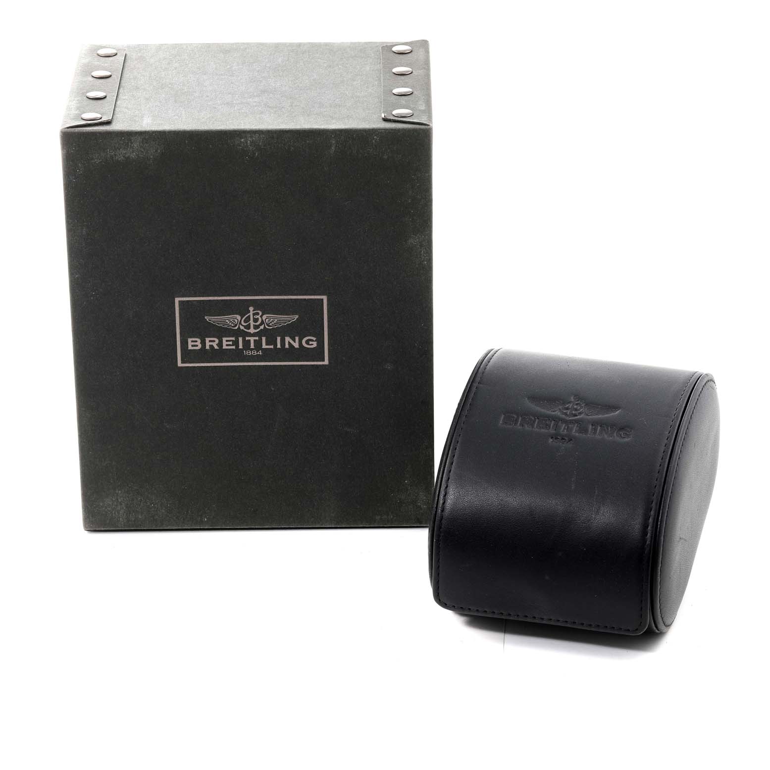 The image shows the packaging for a Breitling Colt A73380 Men's Stainless Steel Blue Dial A73380 Men's Stainless Steel Blue Dial watch, including a black leather case and a green box.