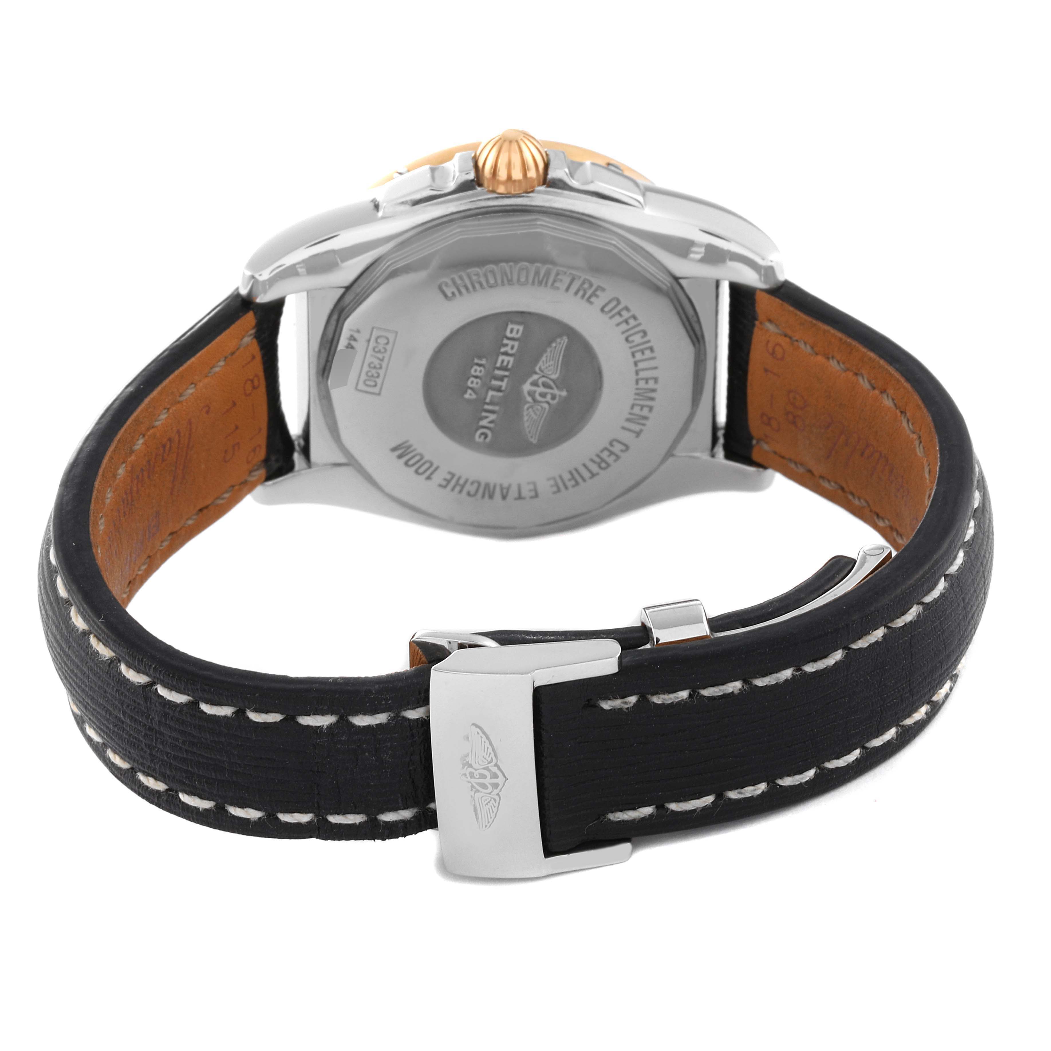 The image shows the back view of a Breitling Galactic C37330 Men's Steel and Gold (two tone) Mother of Pearl Dial C37330 Men's Steel and Gold (two tone) Mother of Pearl Dial watch, featuring its clasp, leather strap, and case back with engravings.